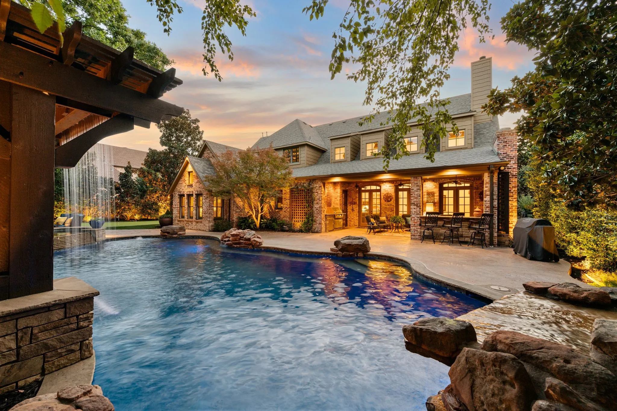 Twilight views of the private backyard, and patio area.