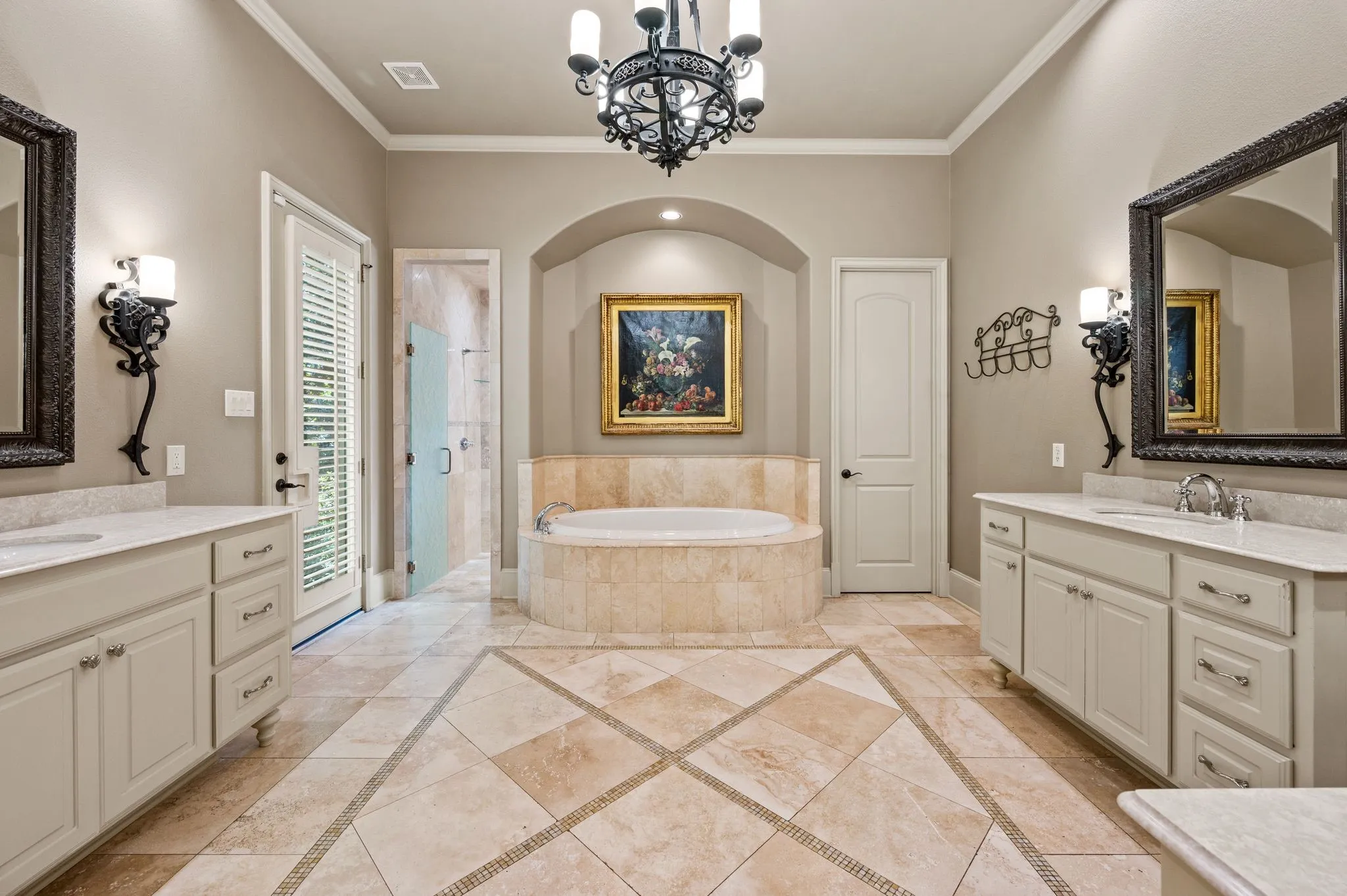 The spacious primary bath offers a luxurious retreat, featuring separate his-and-hers vanities, a dedicated makeup vanity, and a relaxing jetted soaking tub.
