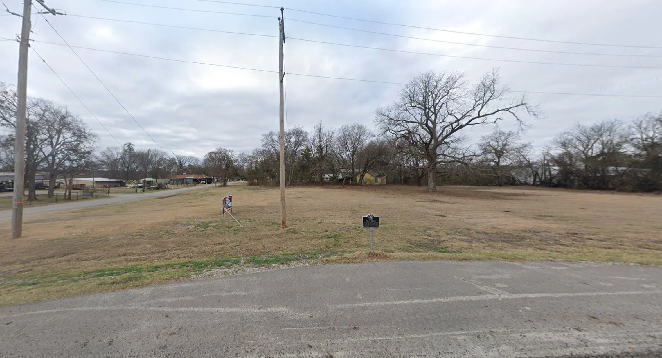 Expansive level lot featuring cleared terrain and mature trees