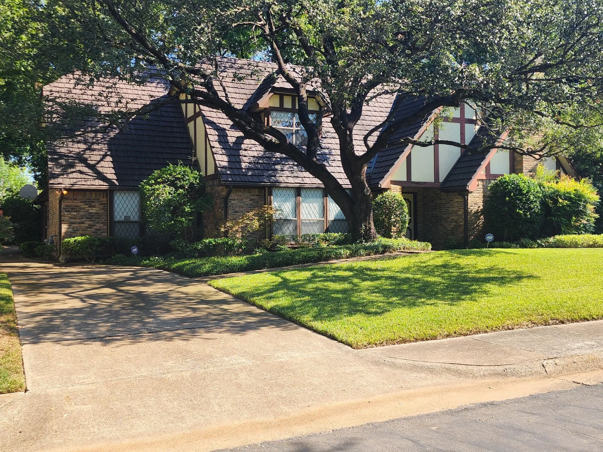 Driveway to side-entry 2-car garage and backyard.