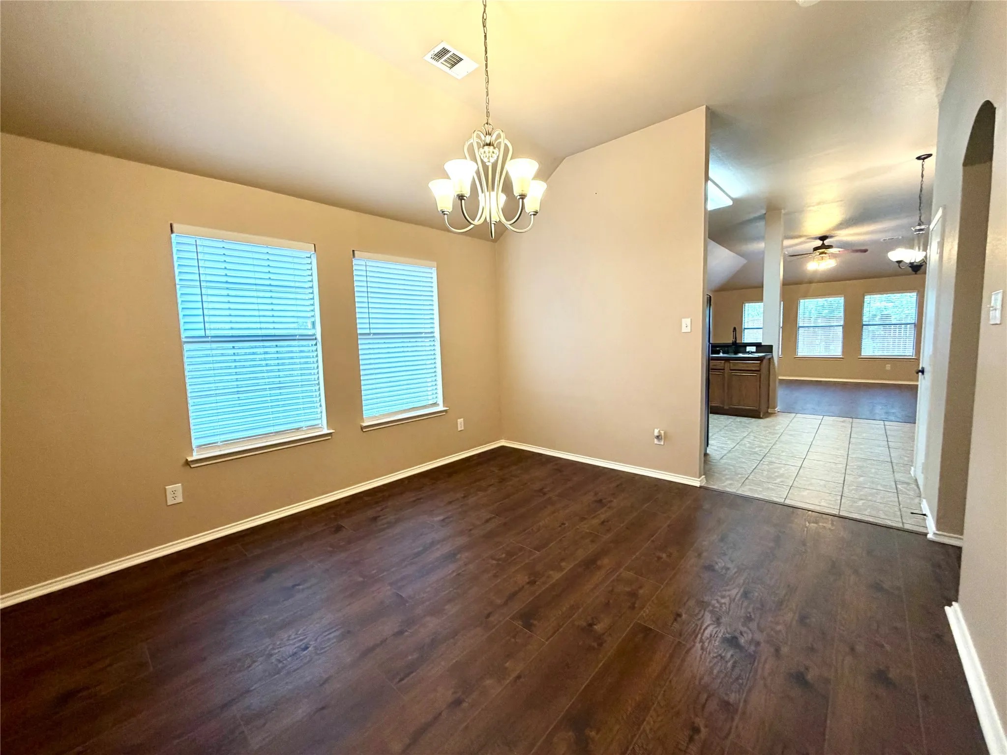 formal dining with kitchen just beyond