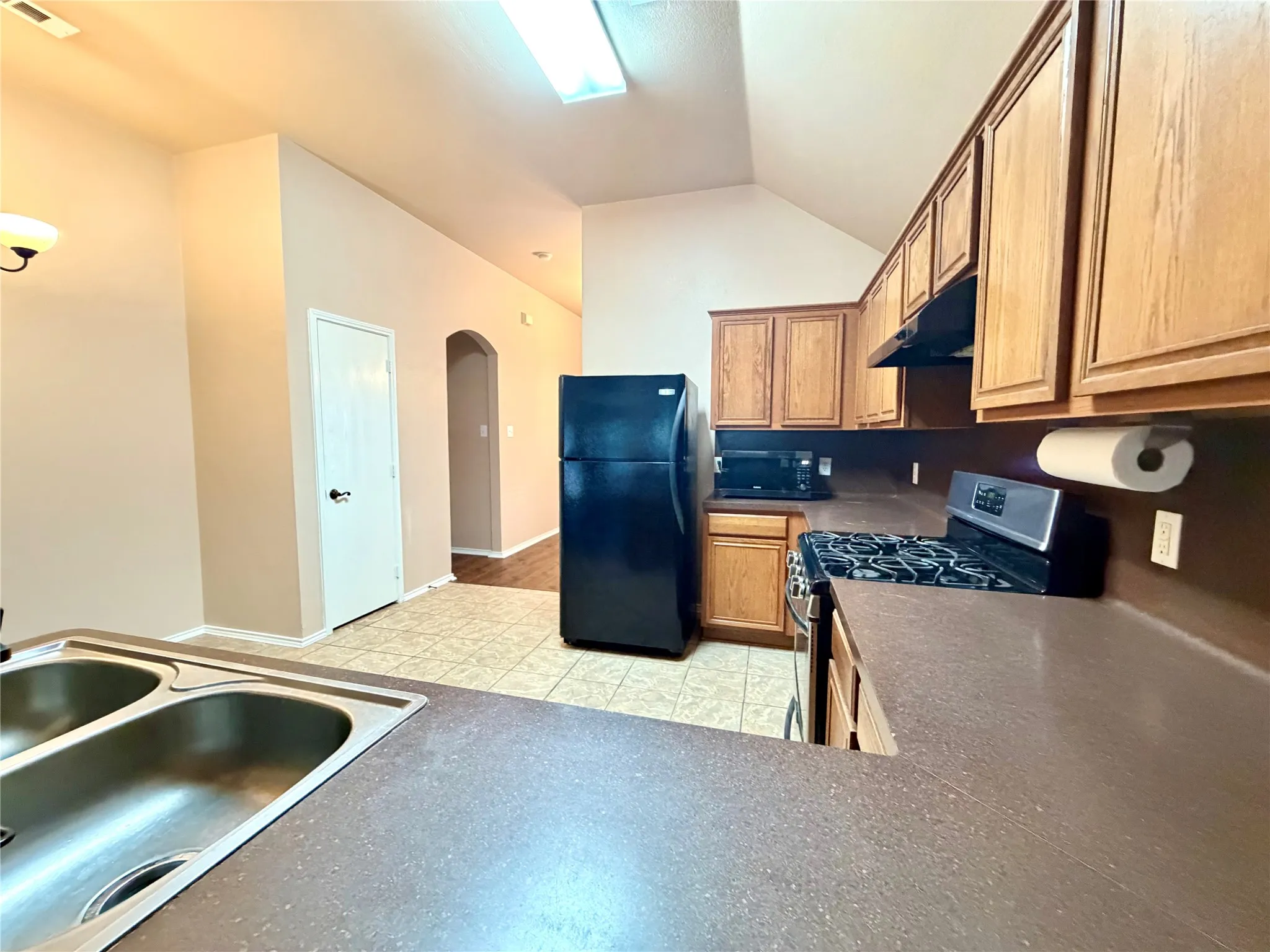 Kitchen featuring gas cooktop range