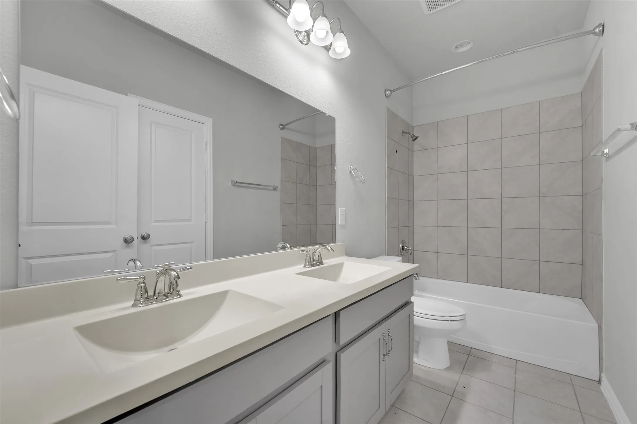 Dual vanity with integrated sinks and chrome fixtures