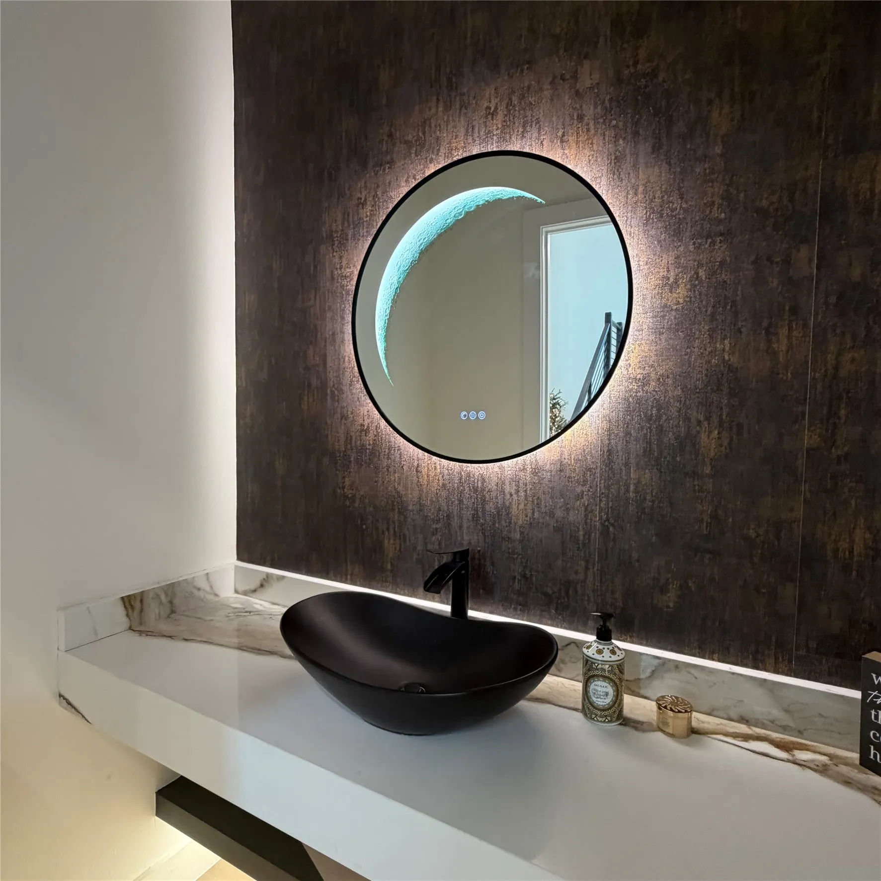 Floating vanity featuring a white surface, matte black oval vessel sink, matching wall-mounted faucet, textured metallic accent wall, and circular LED-backlit mirror