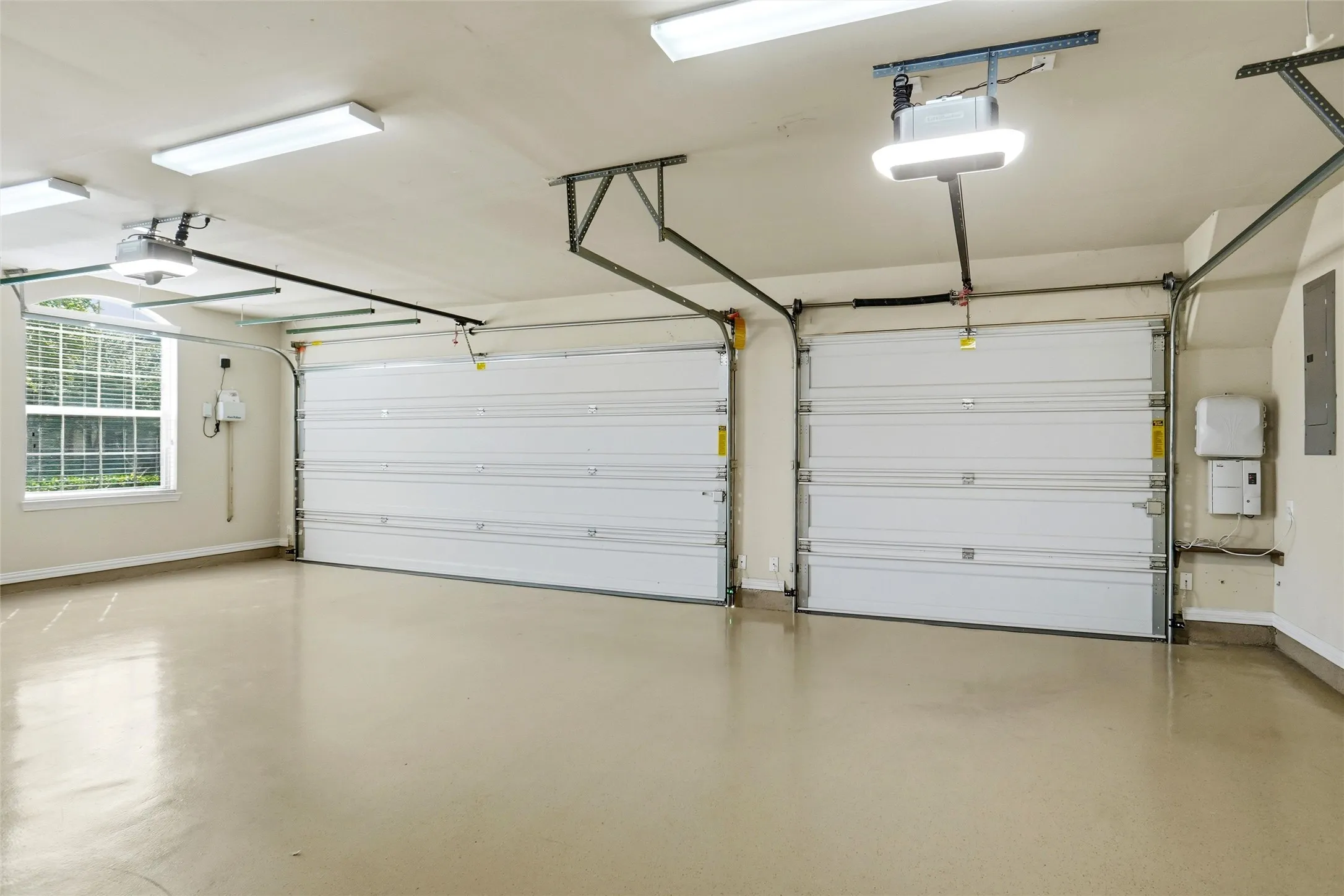 3 car garage with epoxy coated flooring.