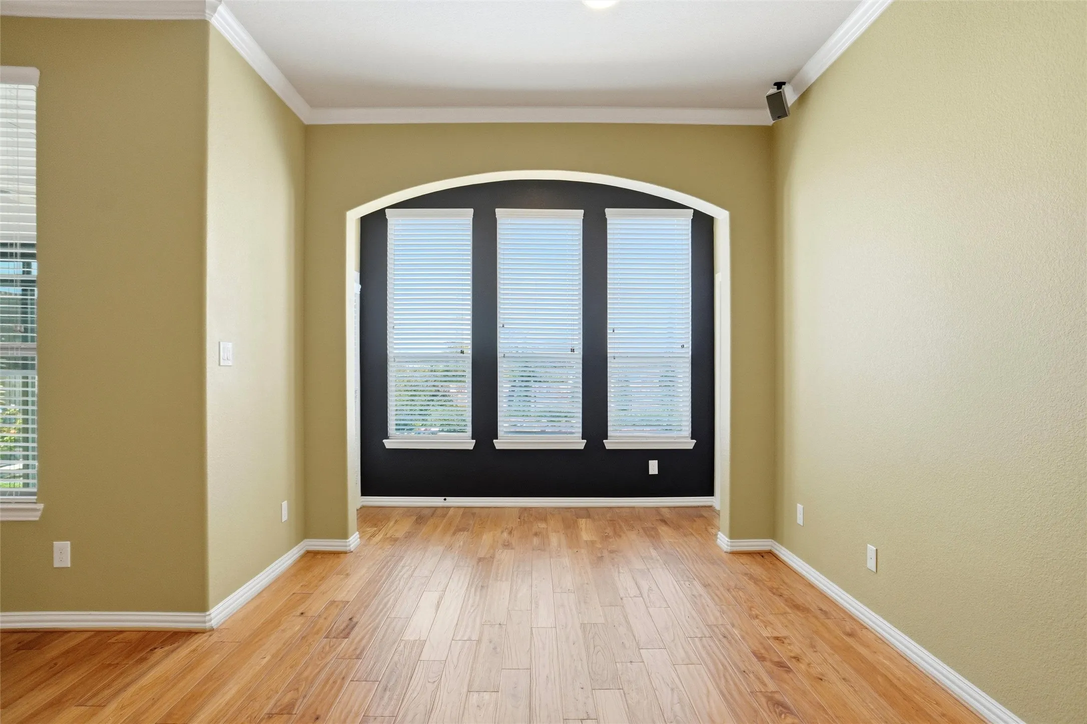 This space leads to the exterior on the left and the primary bedroom to the right.