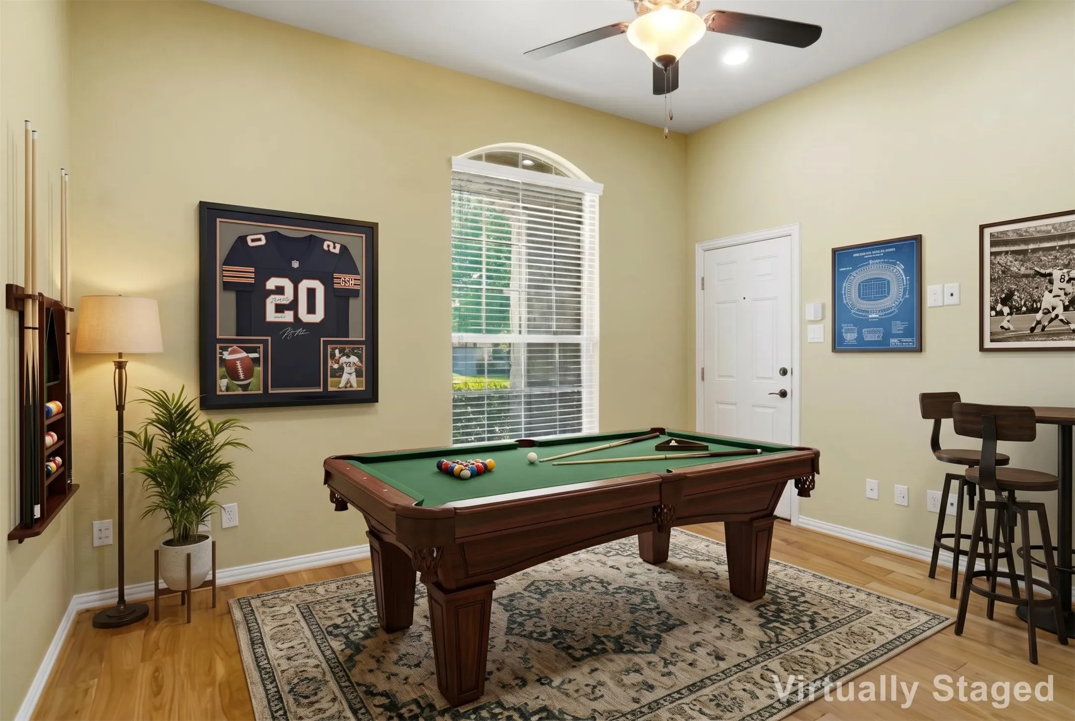 VIRTUALLY STAGED IN LAW SUITE AS A GAMEROOM WITH OUTSIDE ENTRANCE TO PORCH.