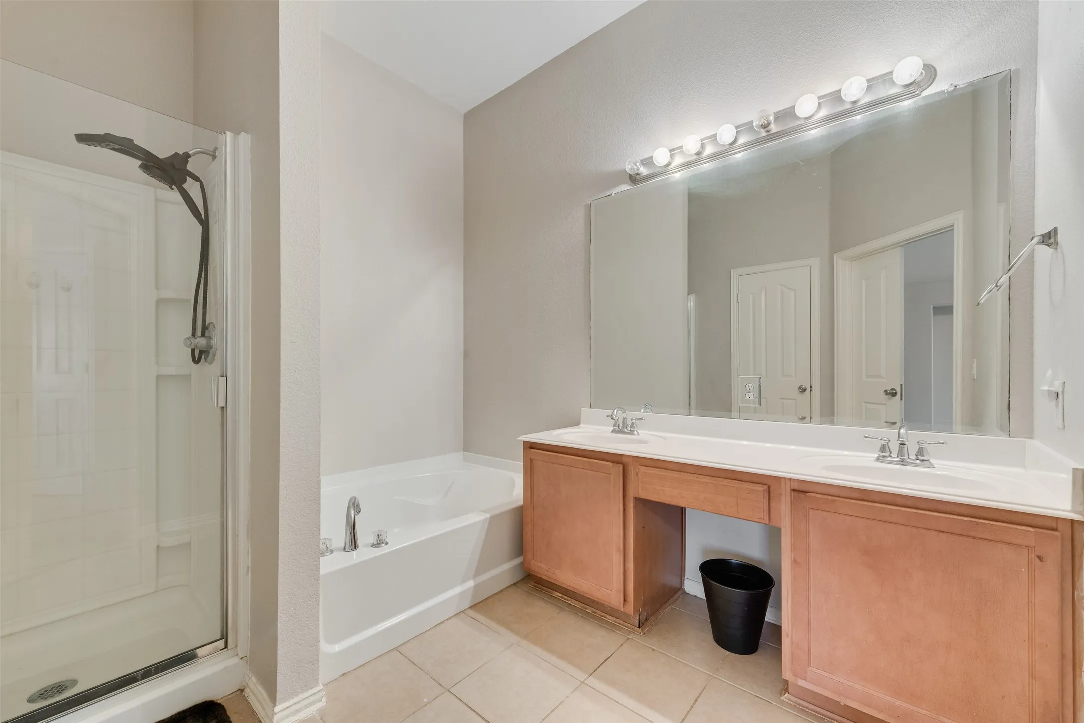 Master Bathroom featuring a dual-sink vanity and a separate shower and tub!