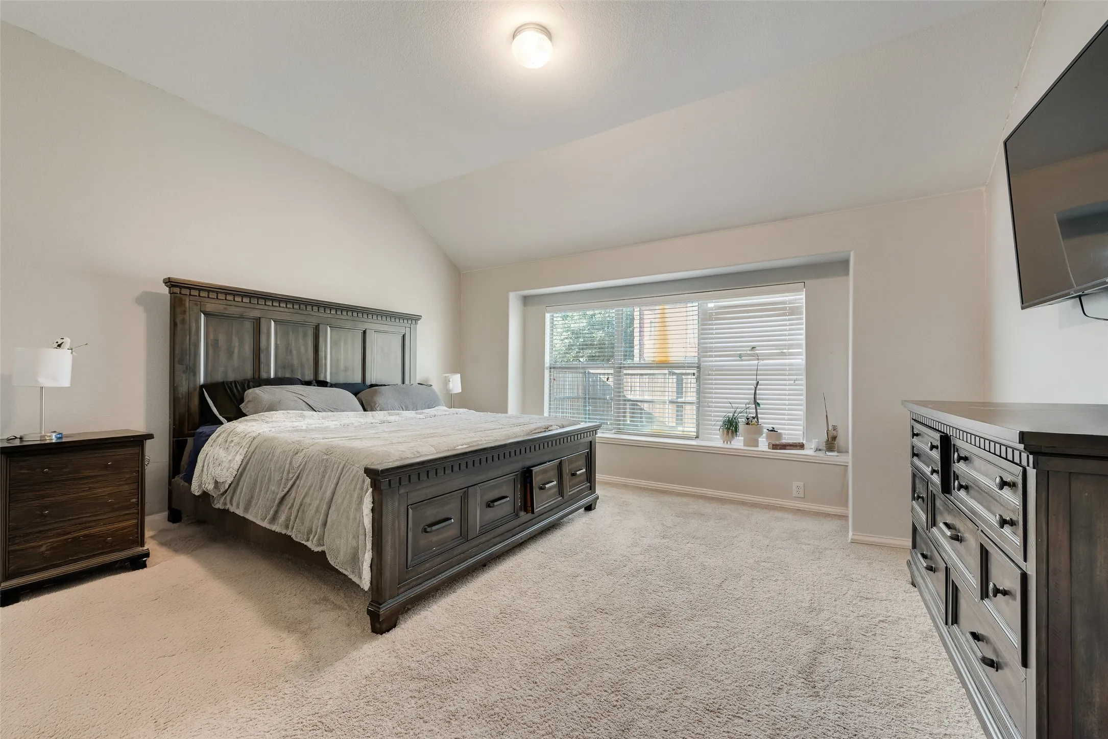 The master bedroom is spacious and it includes vaulted ceilings!