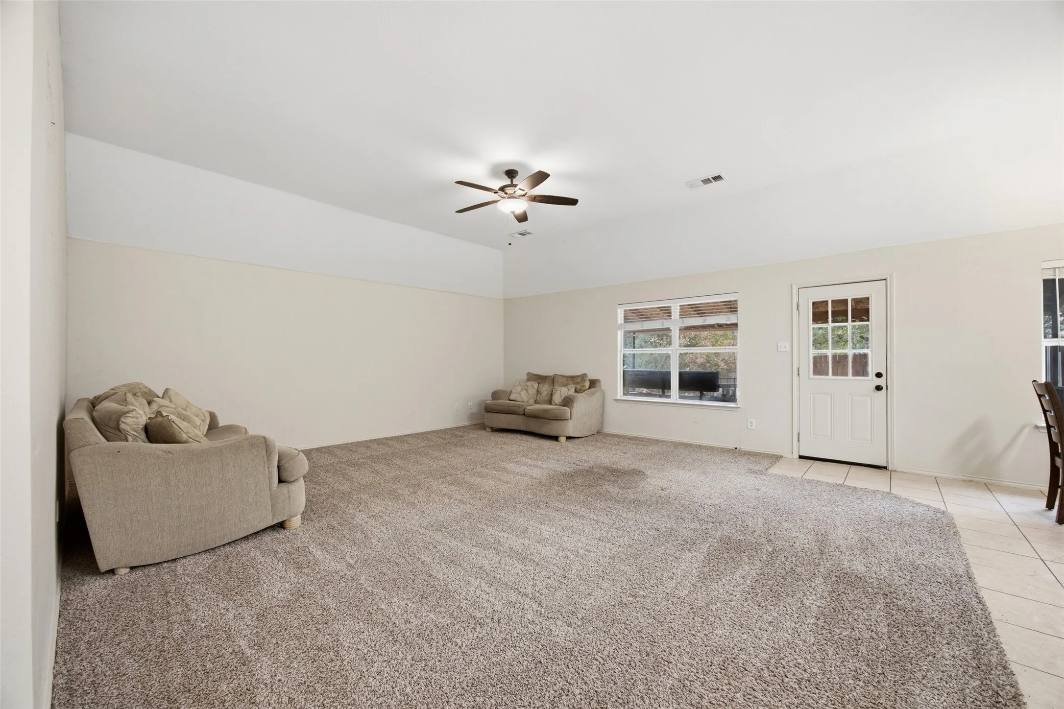 Large living room with tall ceiling
