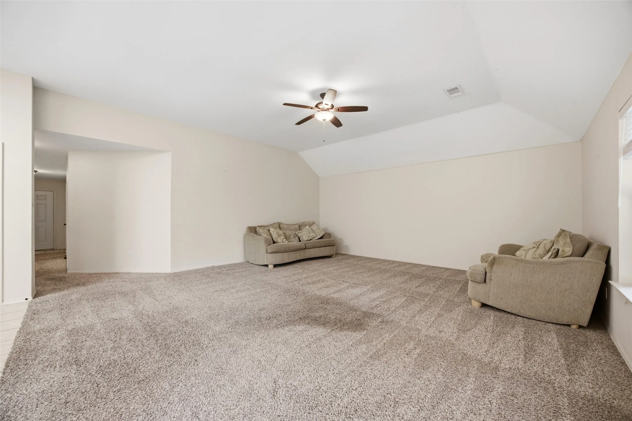 Large living room with tall ceiling