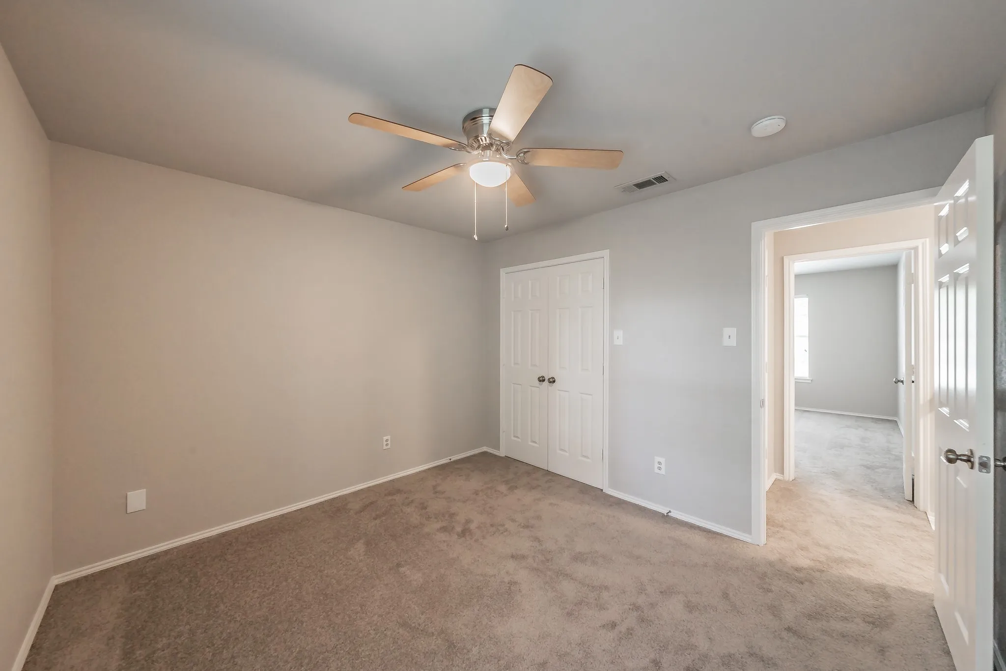 Secondary bedrooms feature carpet, ceiling fans and blinds.