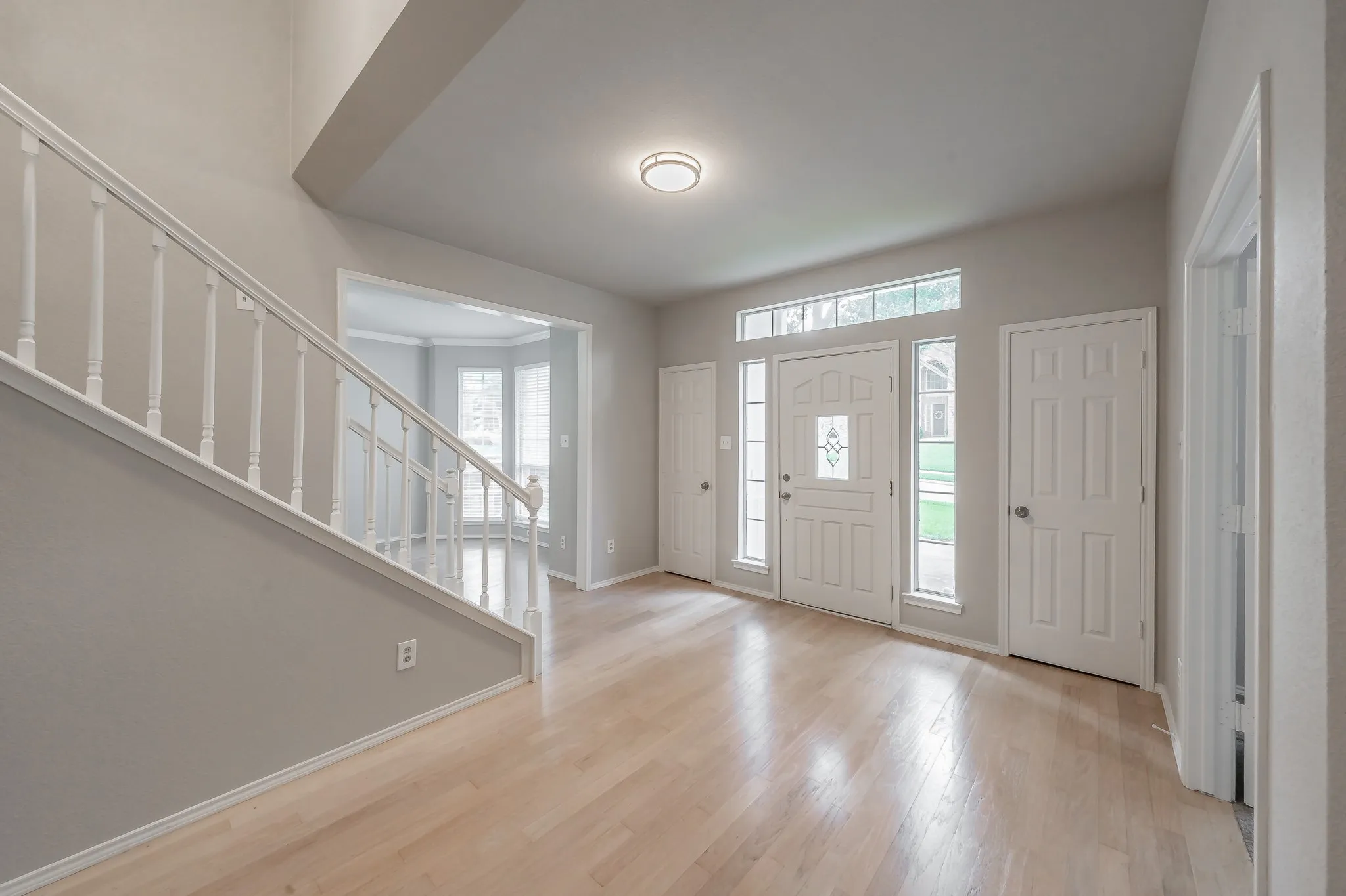 Front foyer with double coat closets. Beautiful hardwood floors greet your guests!