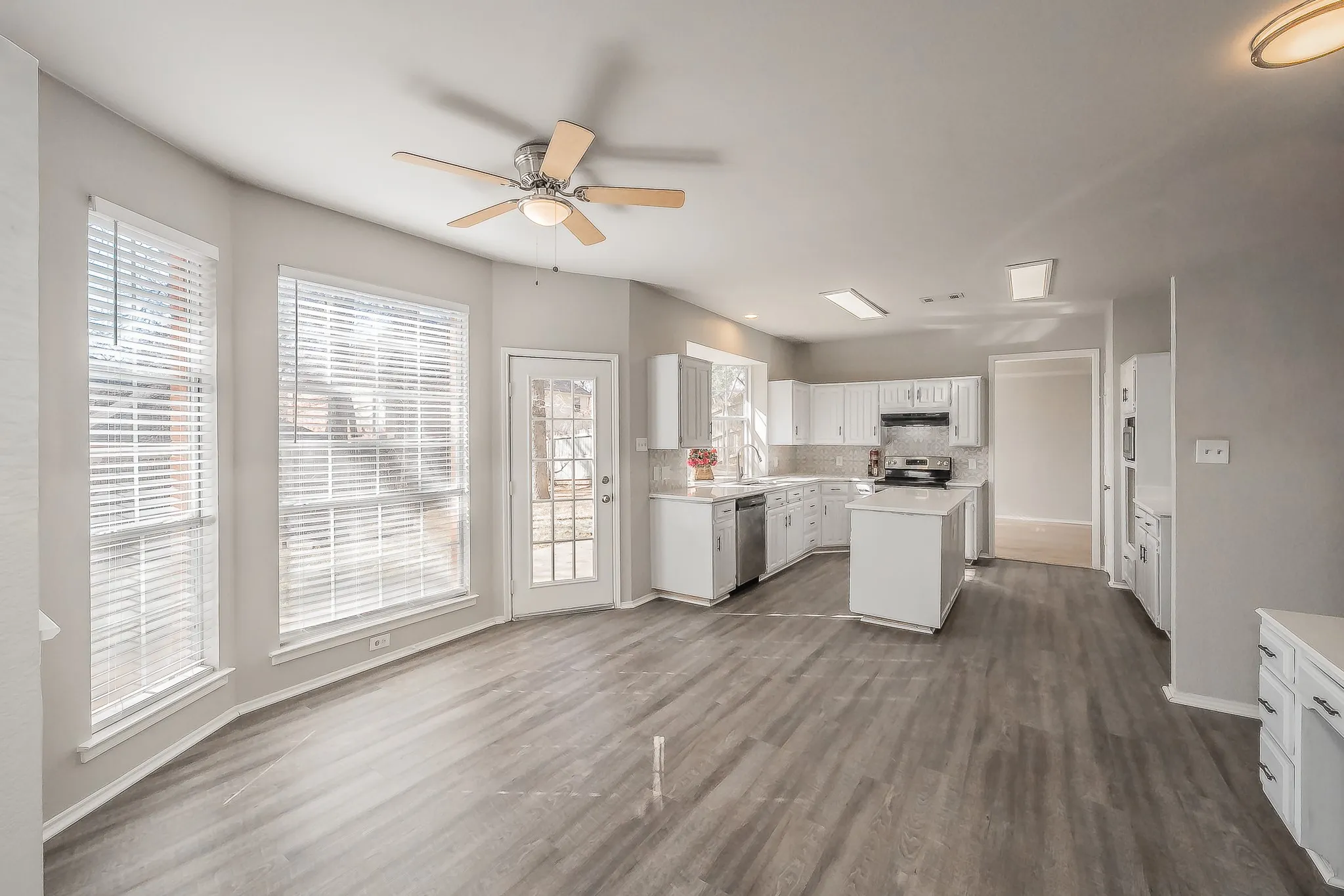 Breakfast area is open to the kitchen & family room. Luxury vinyl wood flooring offers easy care & cleaning. An abundance of windows to watch kids playing or nature!