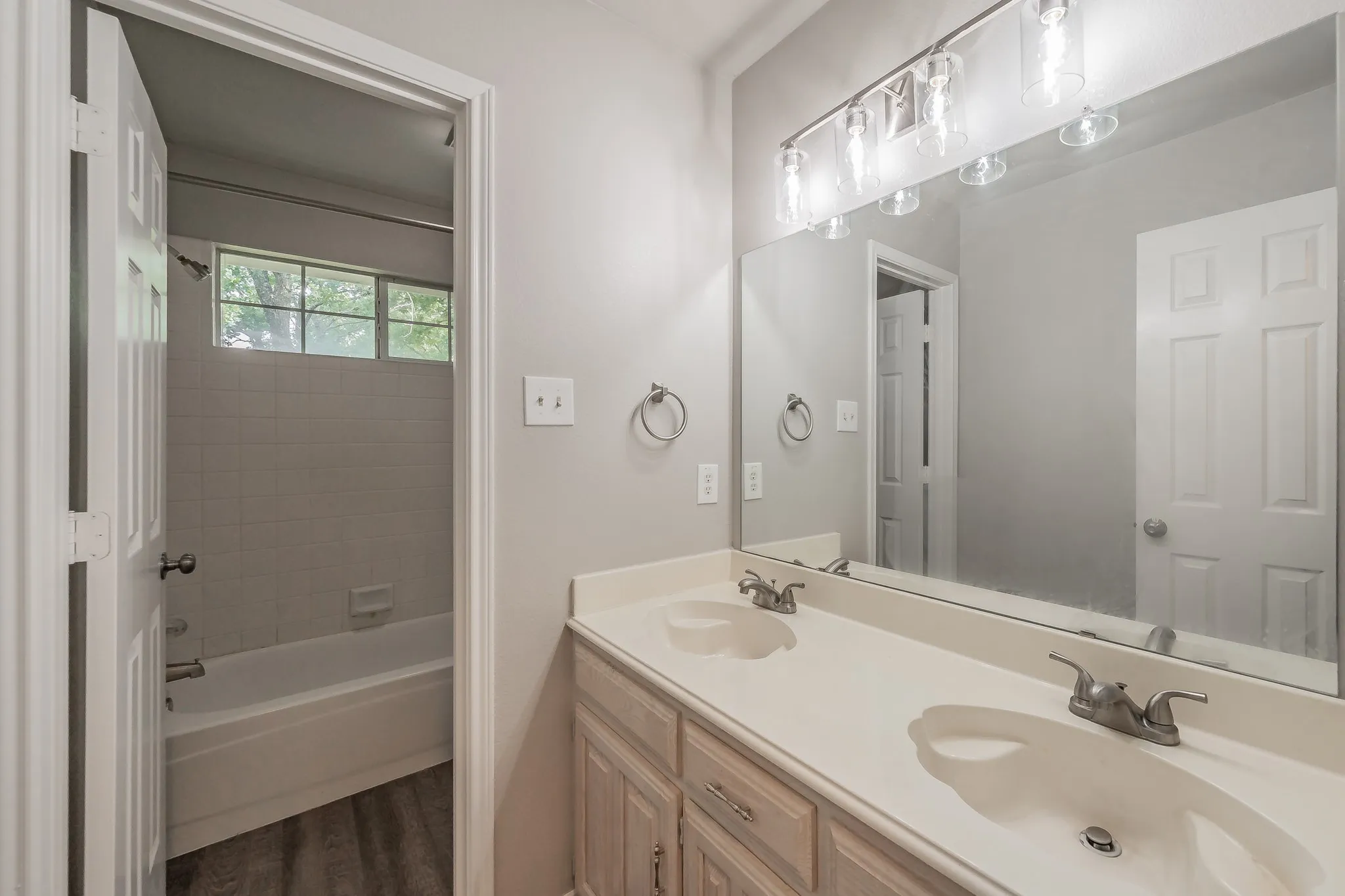 Guest bathroom featuring double sinks.