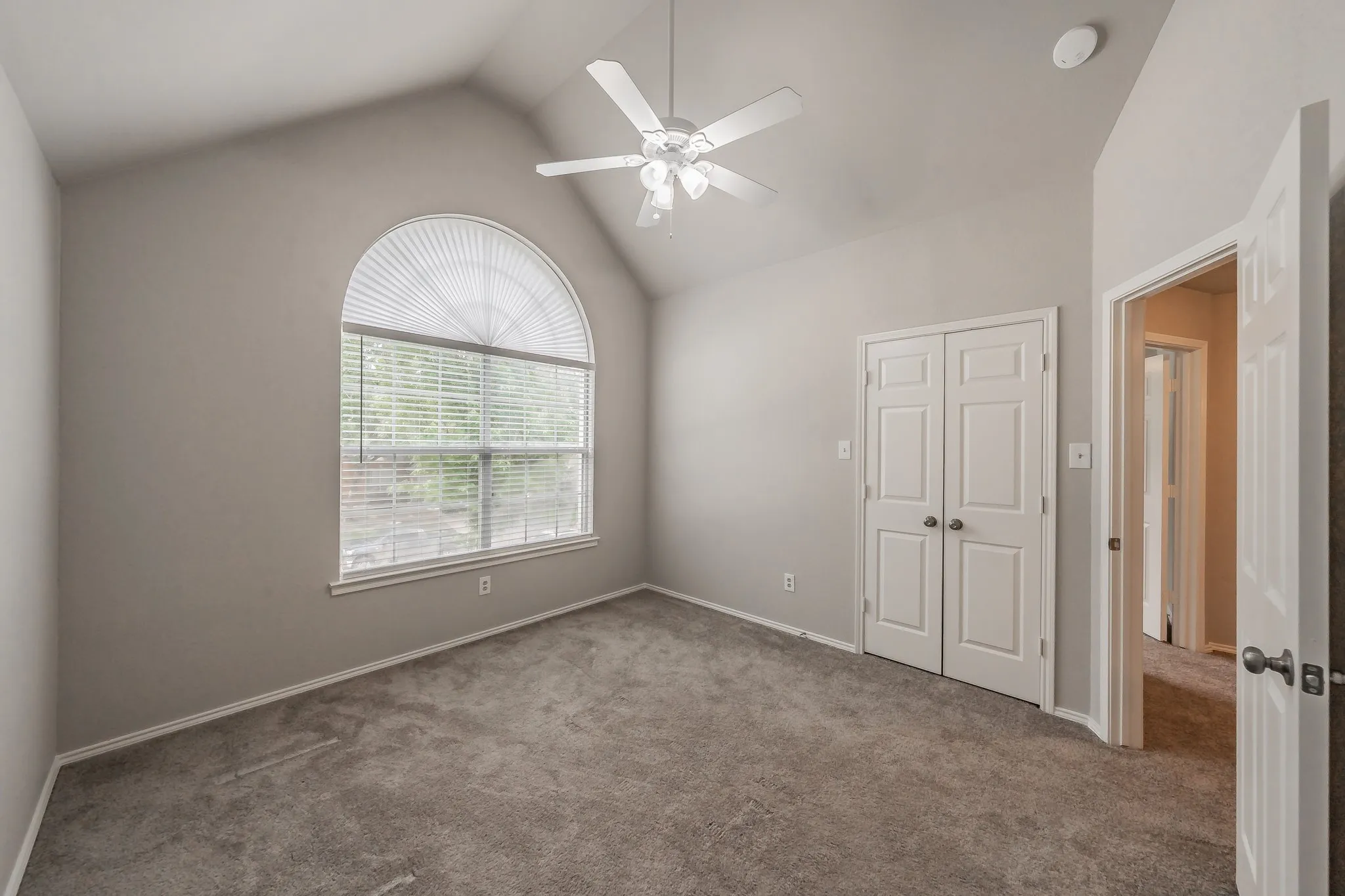 Secondary bedrooms feature carpet, ceiling fans and blinds.