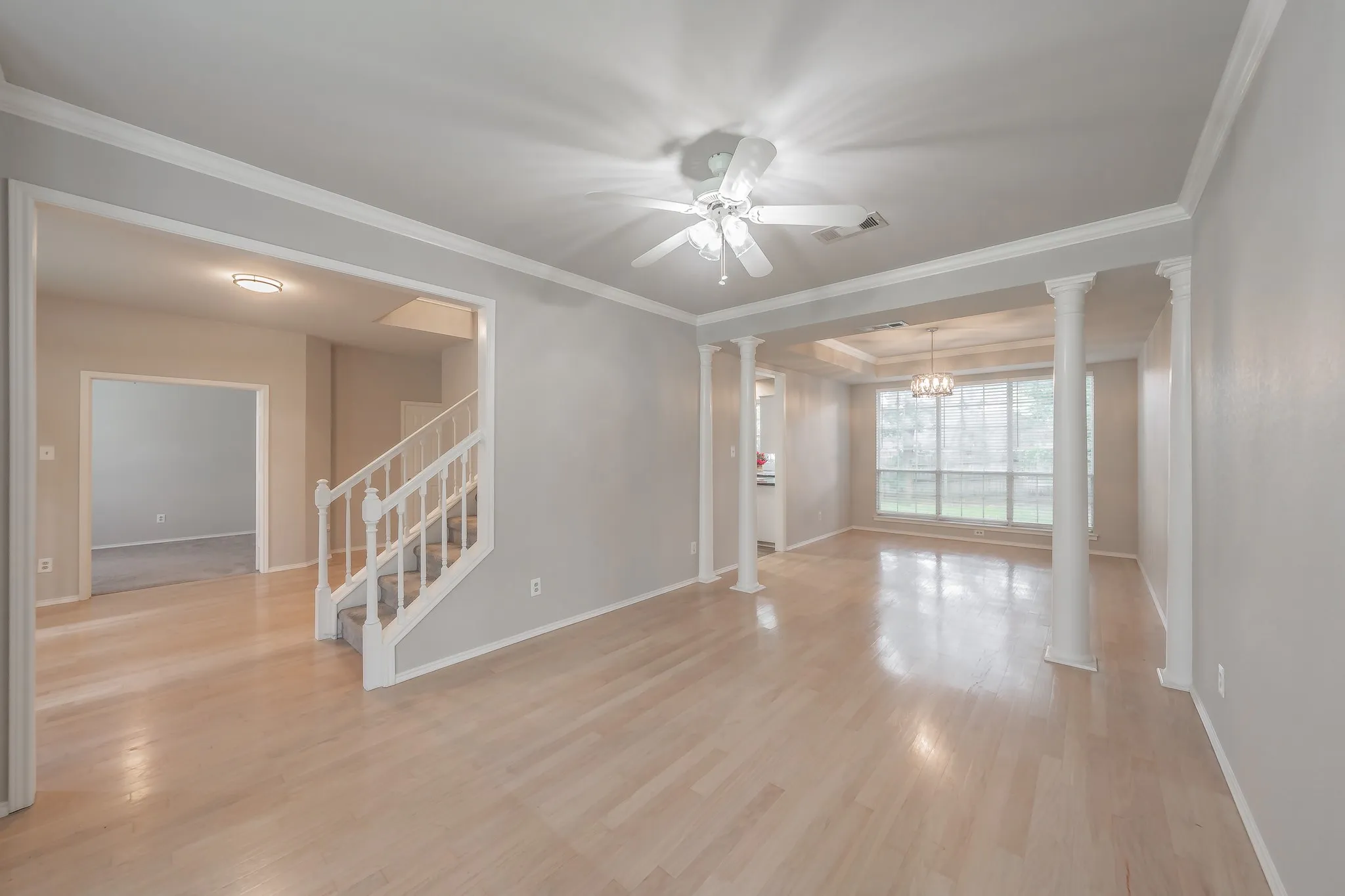 Formal living room is open to dining room ideal for entertaining or space could be used as gameroom, yoga studio, or playroom.