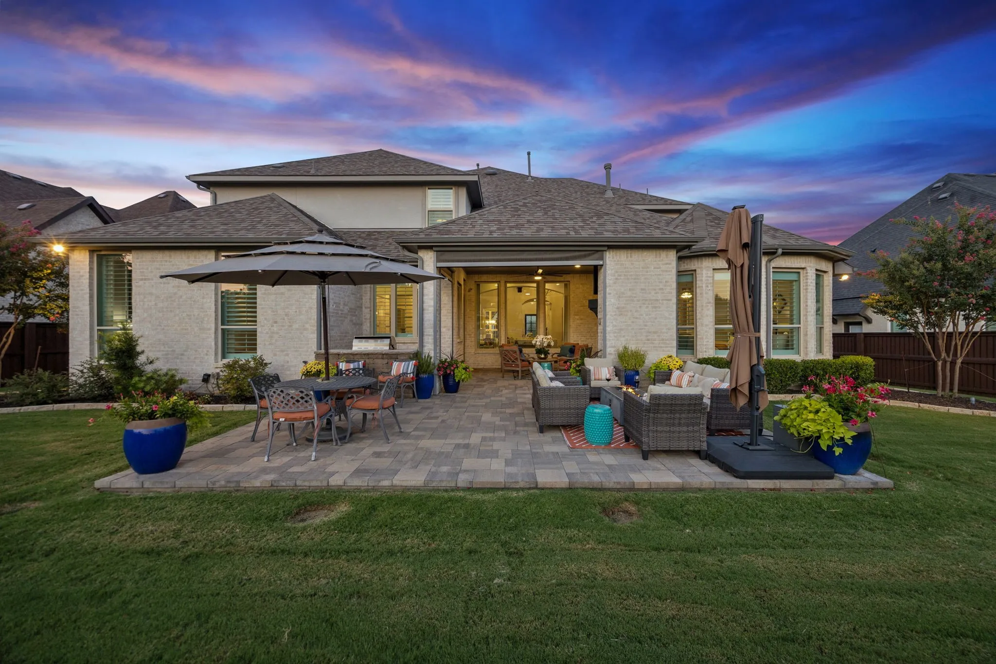 Oversized patio with built-in grill and fireplace is perfect for entertaining.