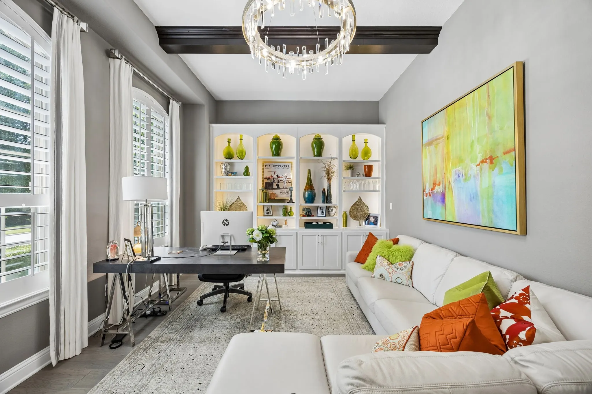 Who wouldn't love this oversized luxury office with beamed ceiling, beautiful chandelier, backlit cabinetry with adjustable shelves, with cabinetry to house files and printer.