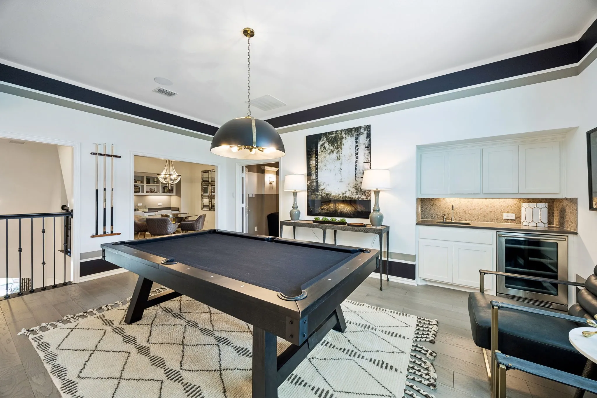 Game room is adjacent to the media room and loft area.