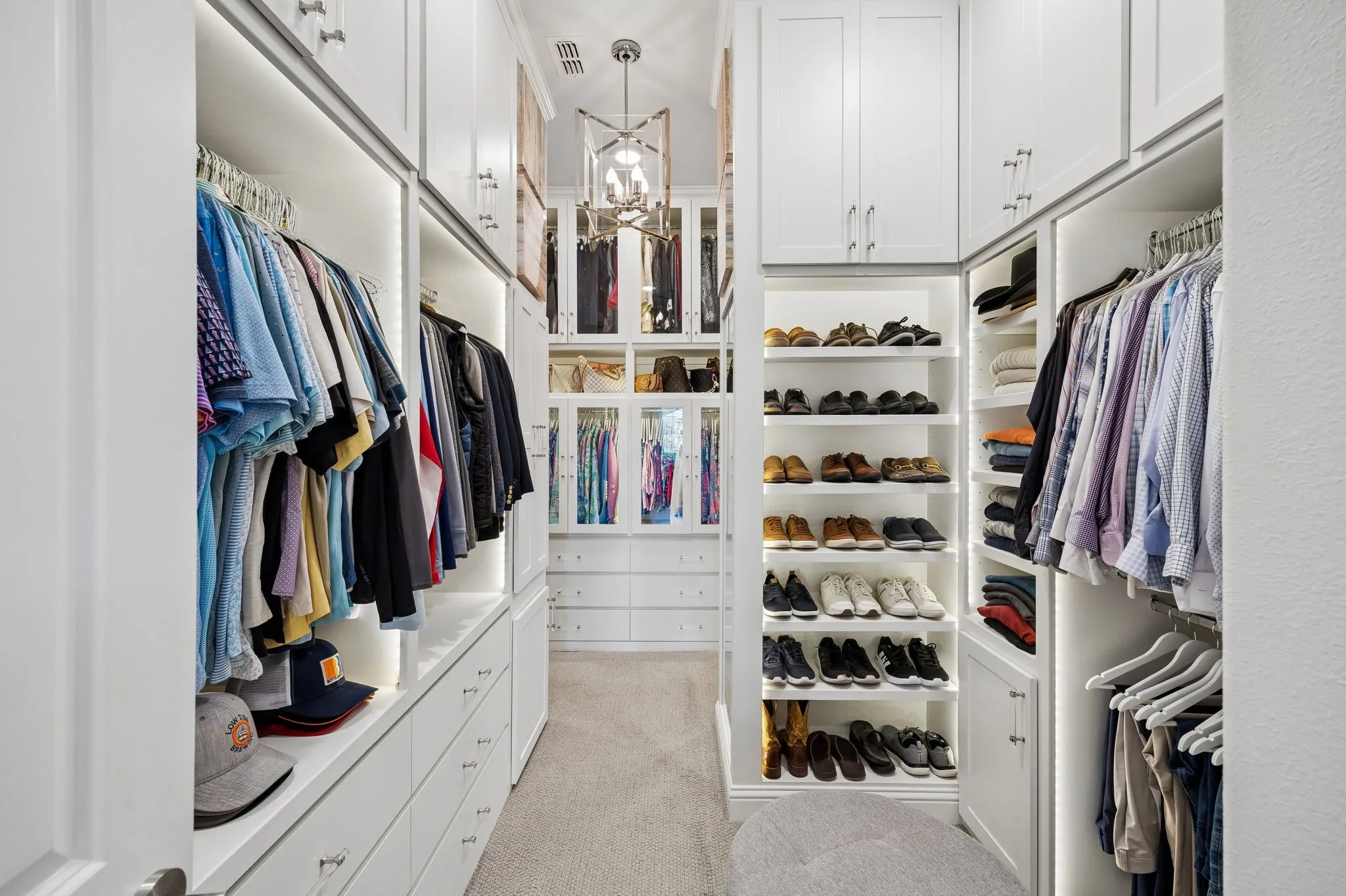 Custom designed and crafted primary closet. A show stopper for sure.