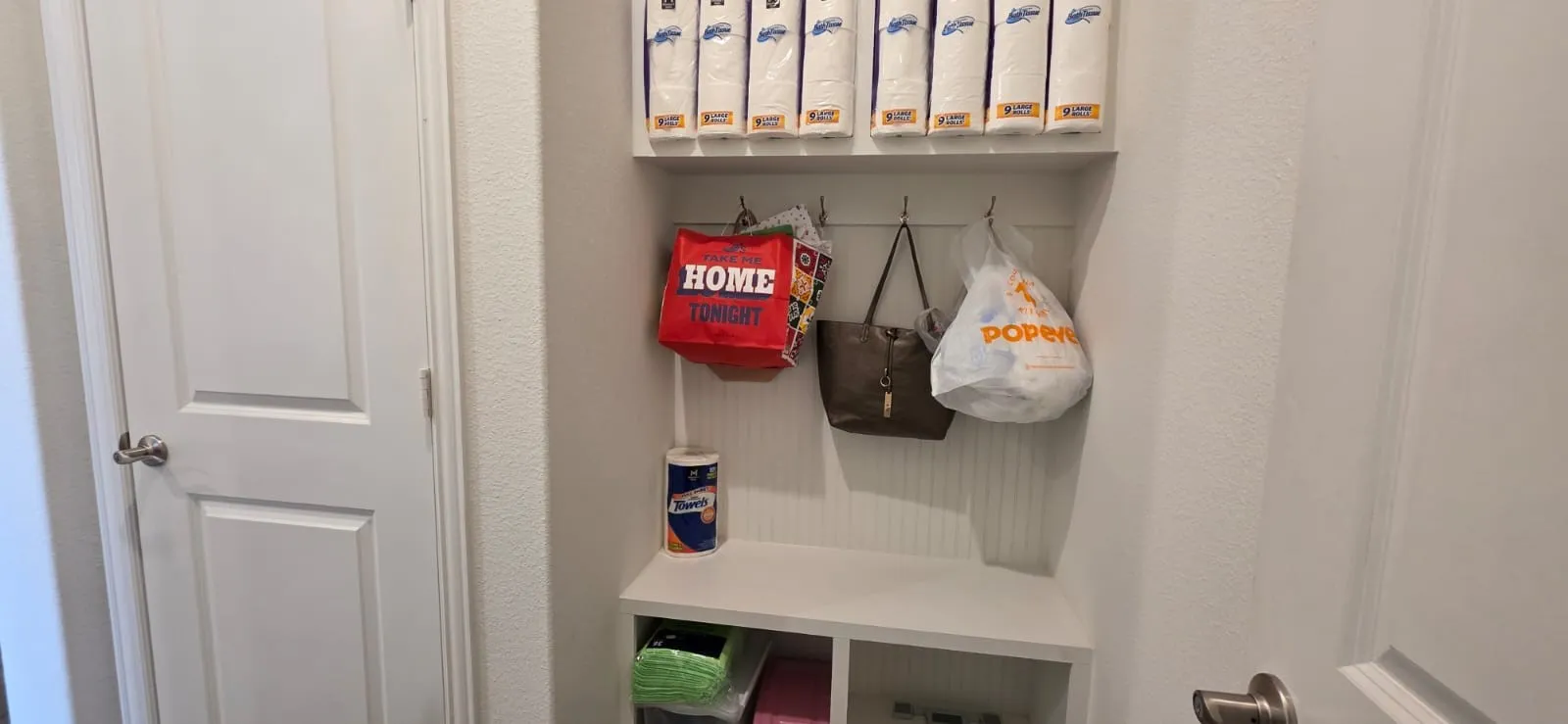 Built-in entryway storage with shelving and integrated hooks