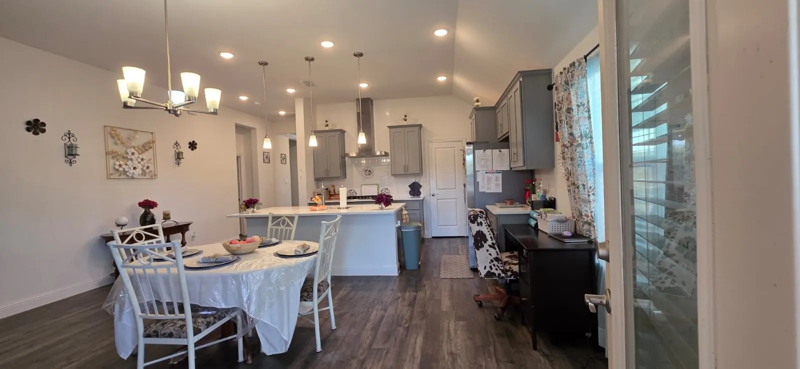 Kitchen featuring gray cabinetry, a central island, recessed lighting, and stainless steel appliances