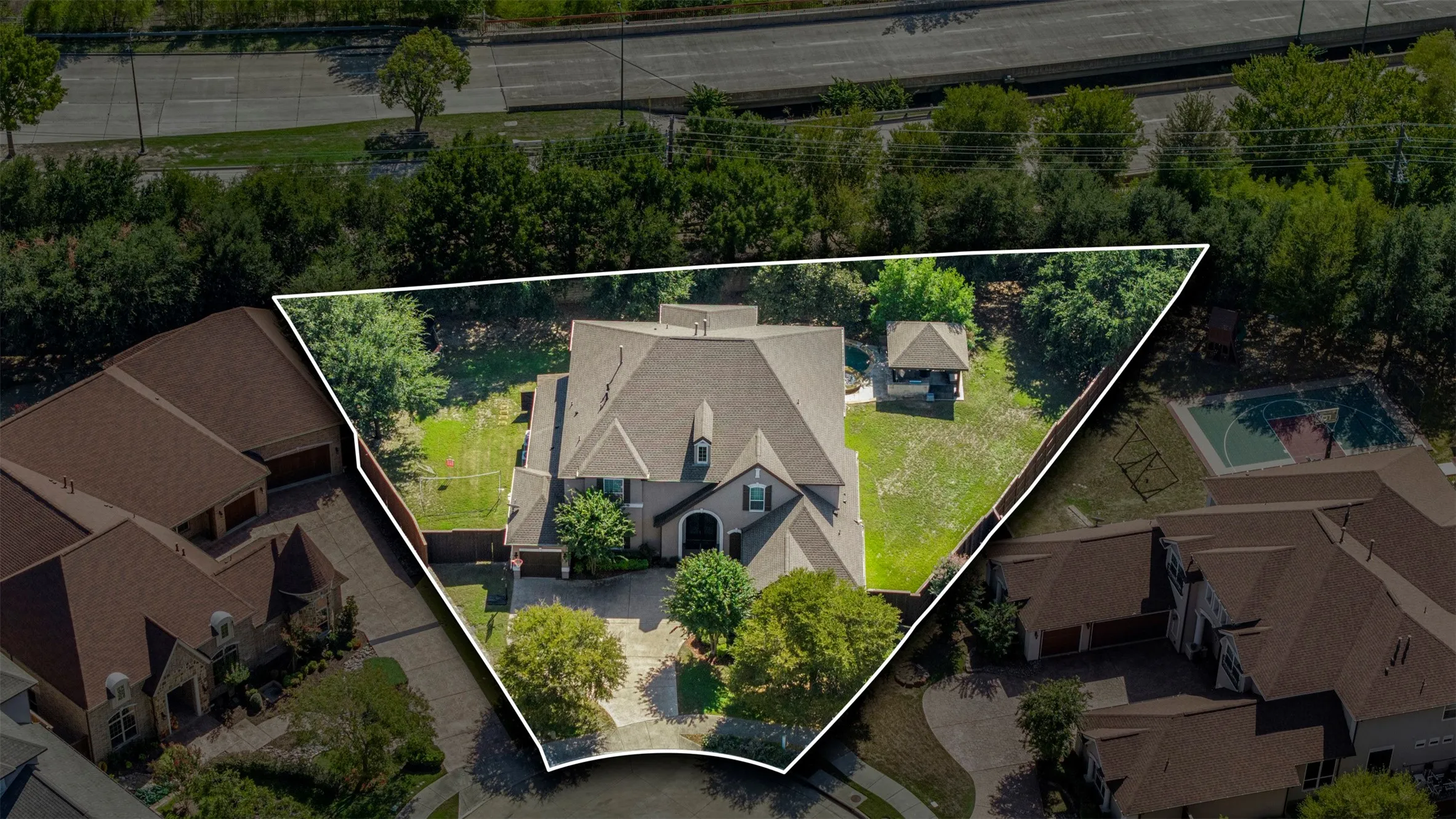 Aerial perspective of a multi-gabled residence featuring a paved driveway, expansive backyard, mature landscaping, and a detached gazebo