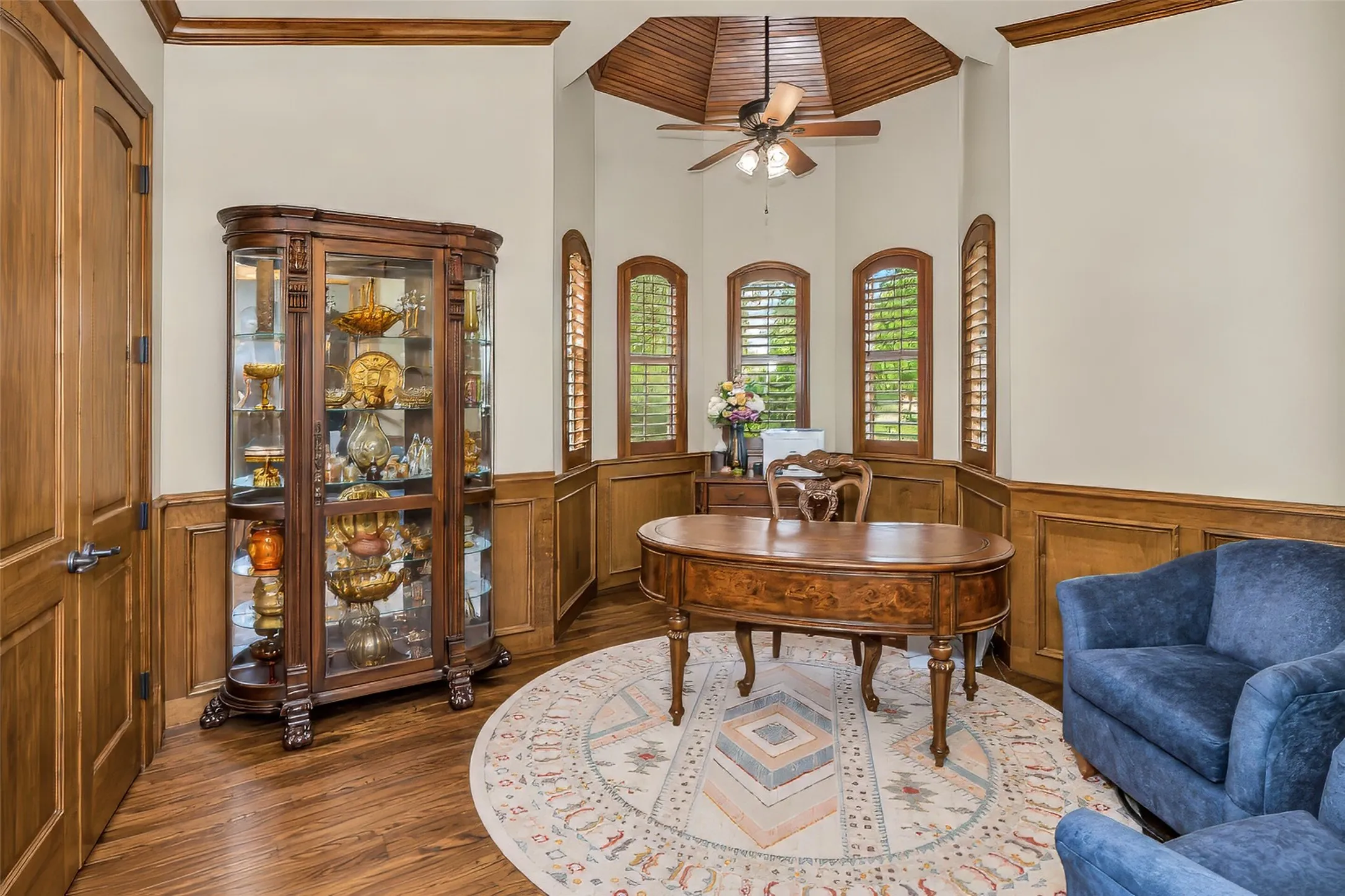 Formal study/office featuring wainscot detailing and rotunda.