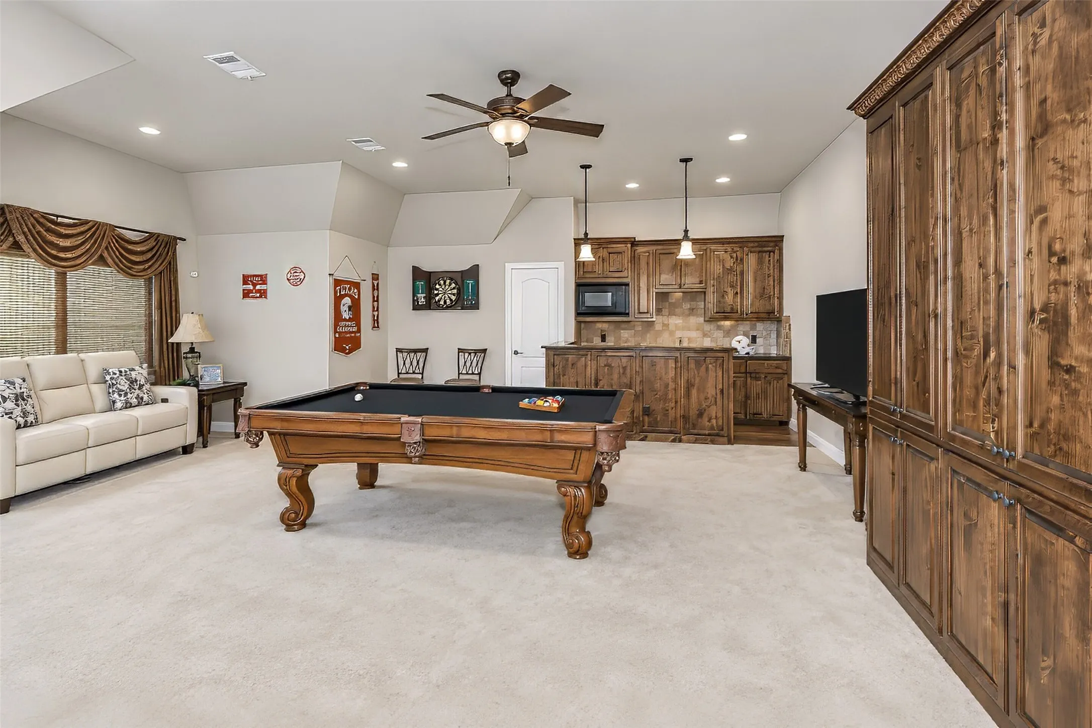 Upstairs, an impressive game room awaits.