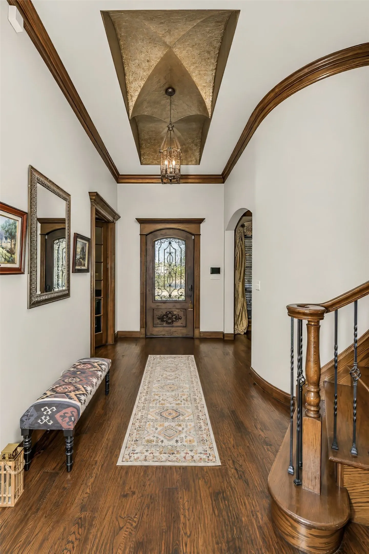 Dramatic grand entry features amazing millwork and groin ceiling detail.