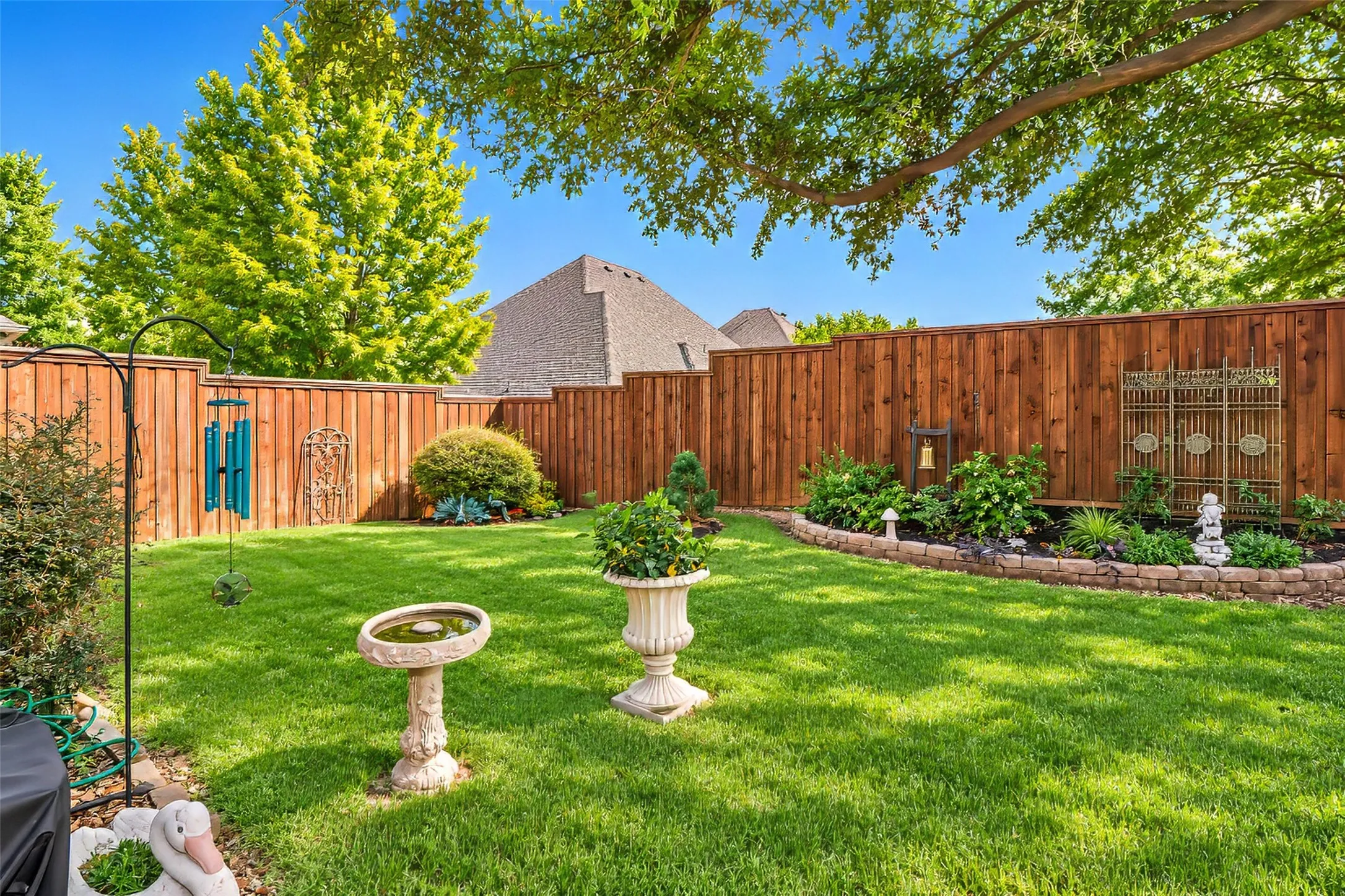 Beautifully landscaped back yard is very private.