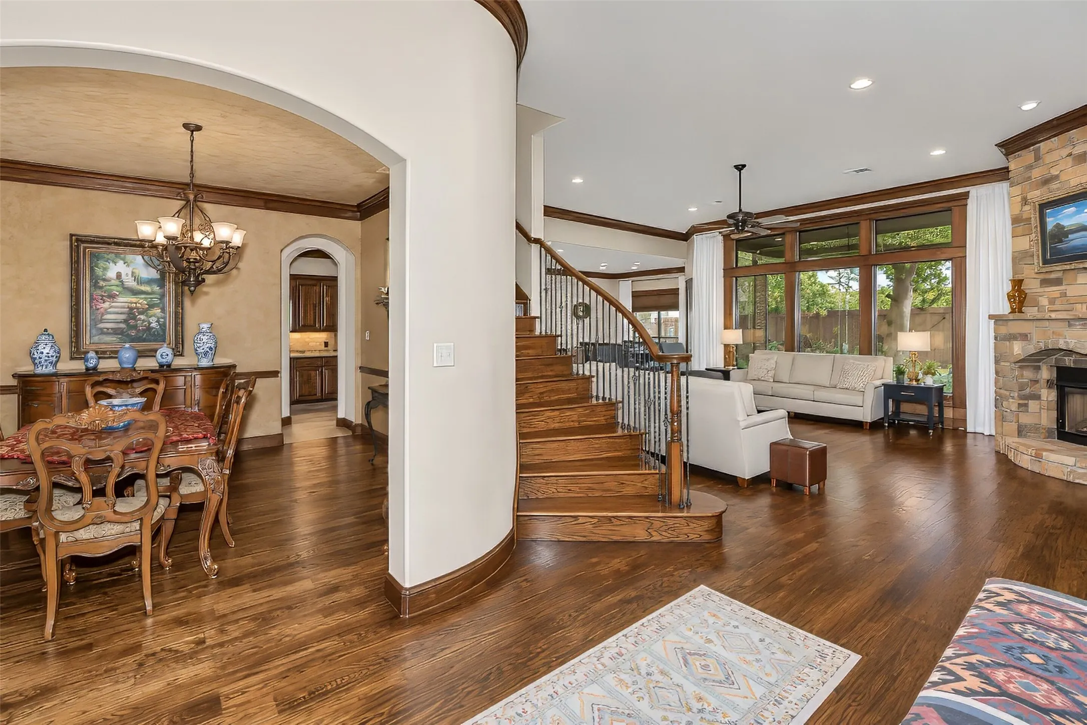 Formal dining and grand staircase just off foyer.