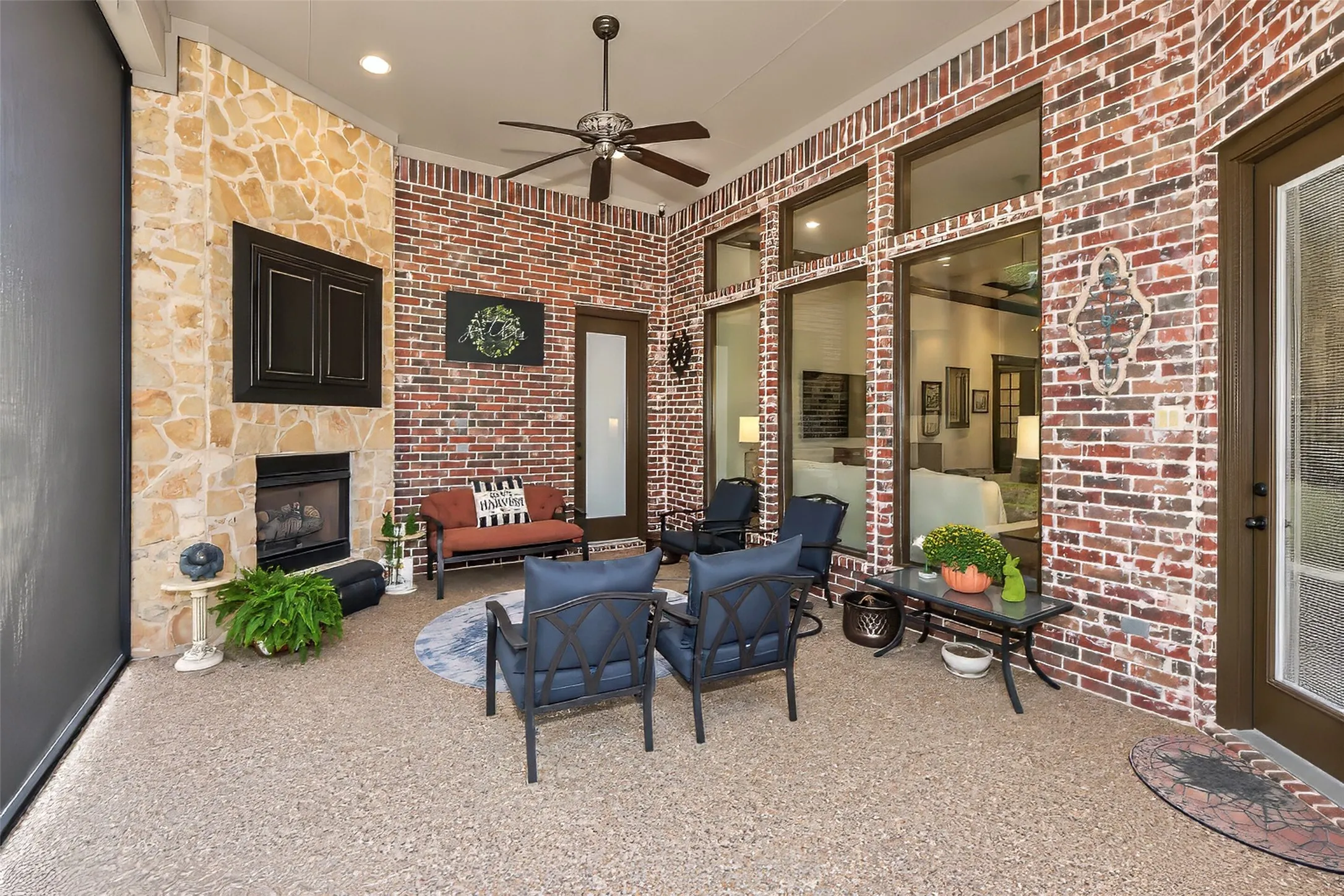 Enjoy this outdoor covered patio complete with gas log fireplace and space for a television.
