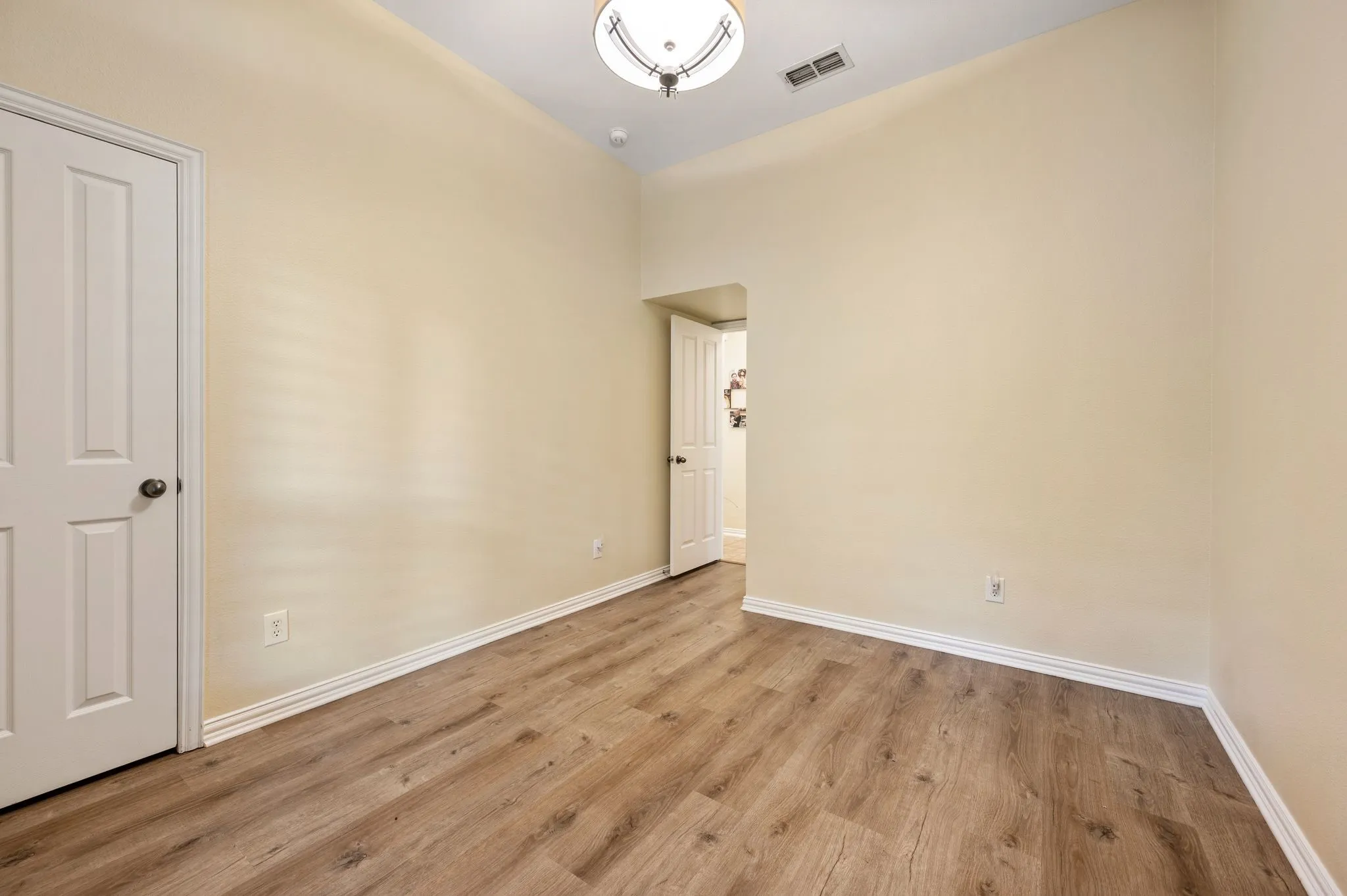 First floor bedrooms have recently added beautiful and easy care wood tone luxury vinyl plank flooring