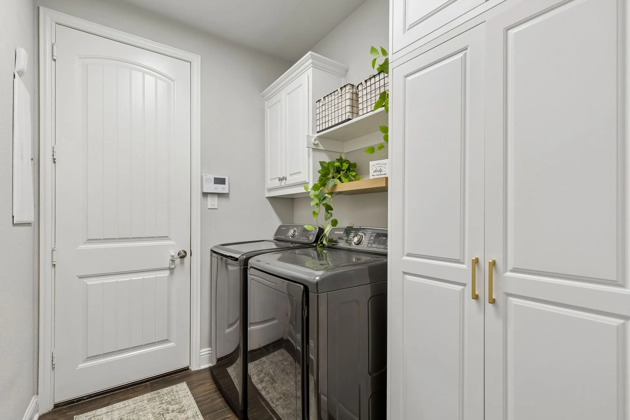 Separate unility room with extra storage.