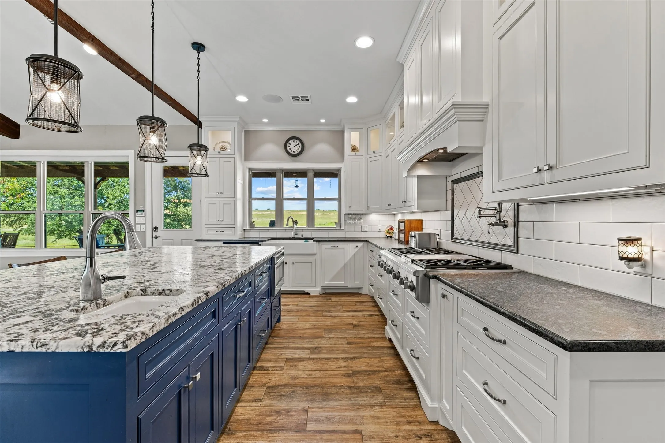 There is plenty of room in this kitchen to gather and cook together.