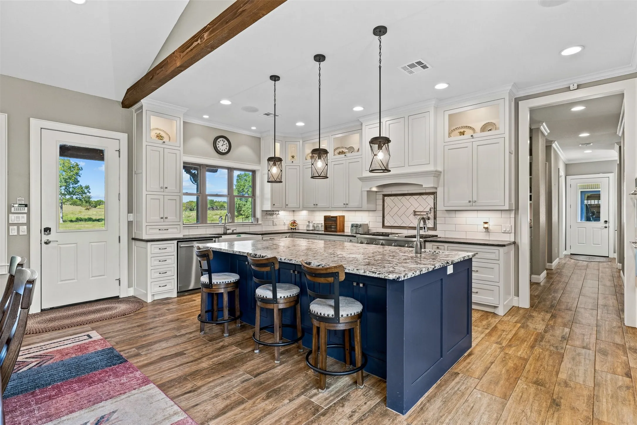 The chef's kitchen is open to the living and dining areas.