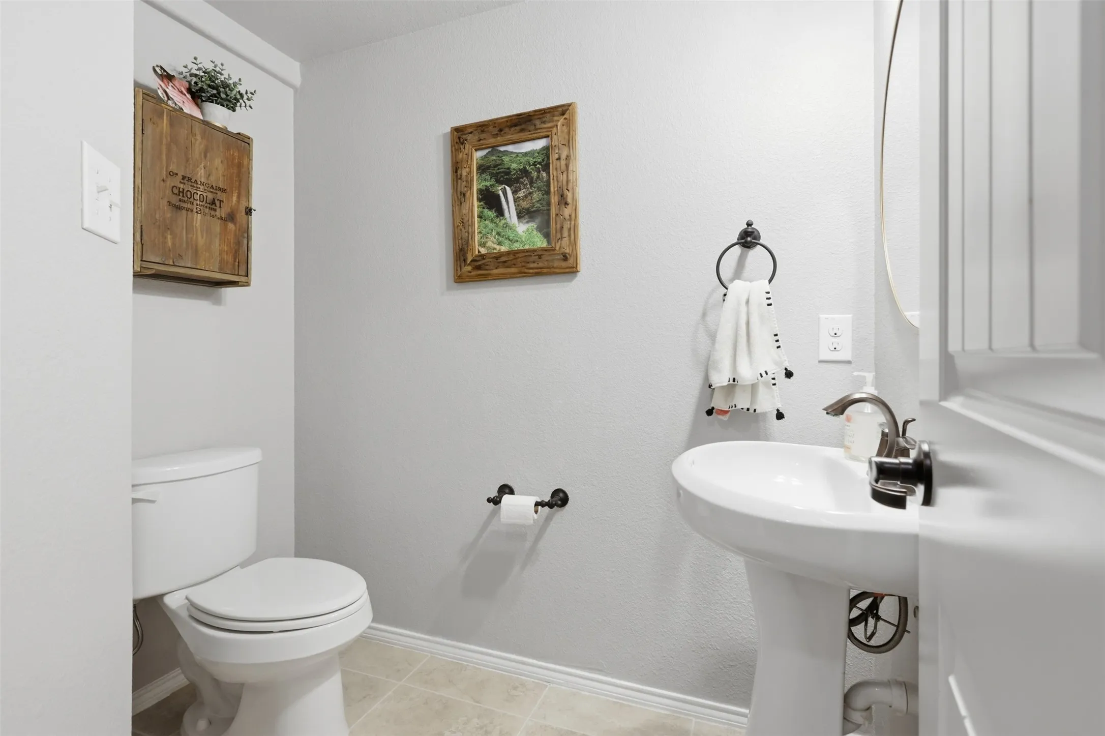 Half bath is perfectly situated off of the living room.