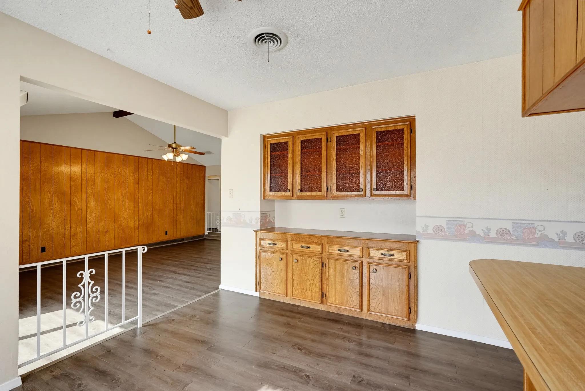 Glass-front cabinets and a built-in buffet turn this corner into a showcase for china and keepsakes.