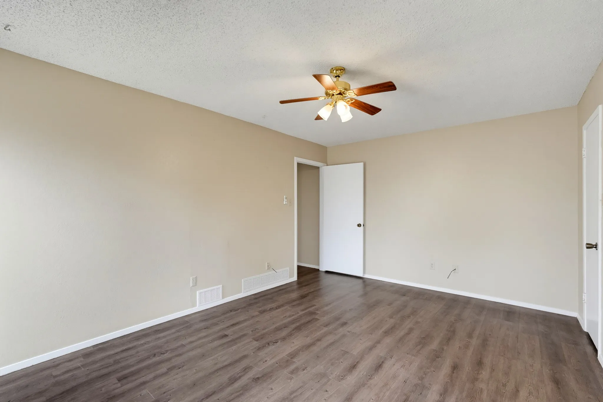 Plenty of floor space for a big bed, dressers, and a reading chair.