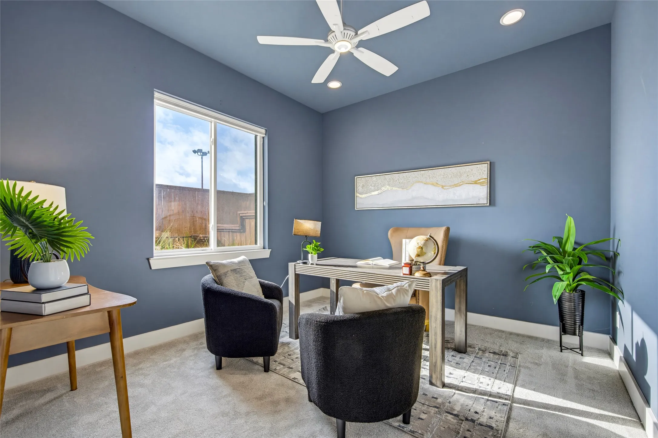 Room featuring neutral carpeting, a white ceiling fan with integrated lighting, recessed lighting, and a single-pane window
