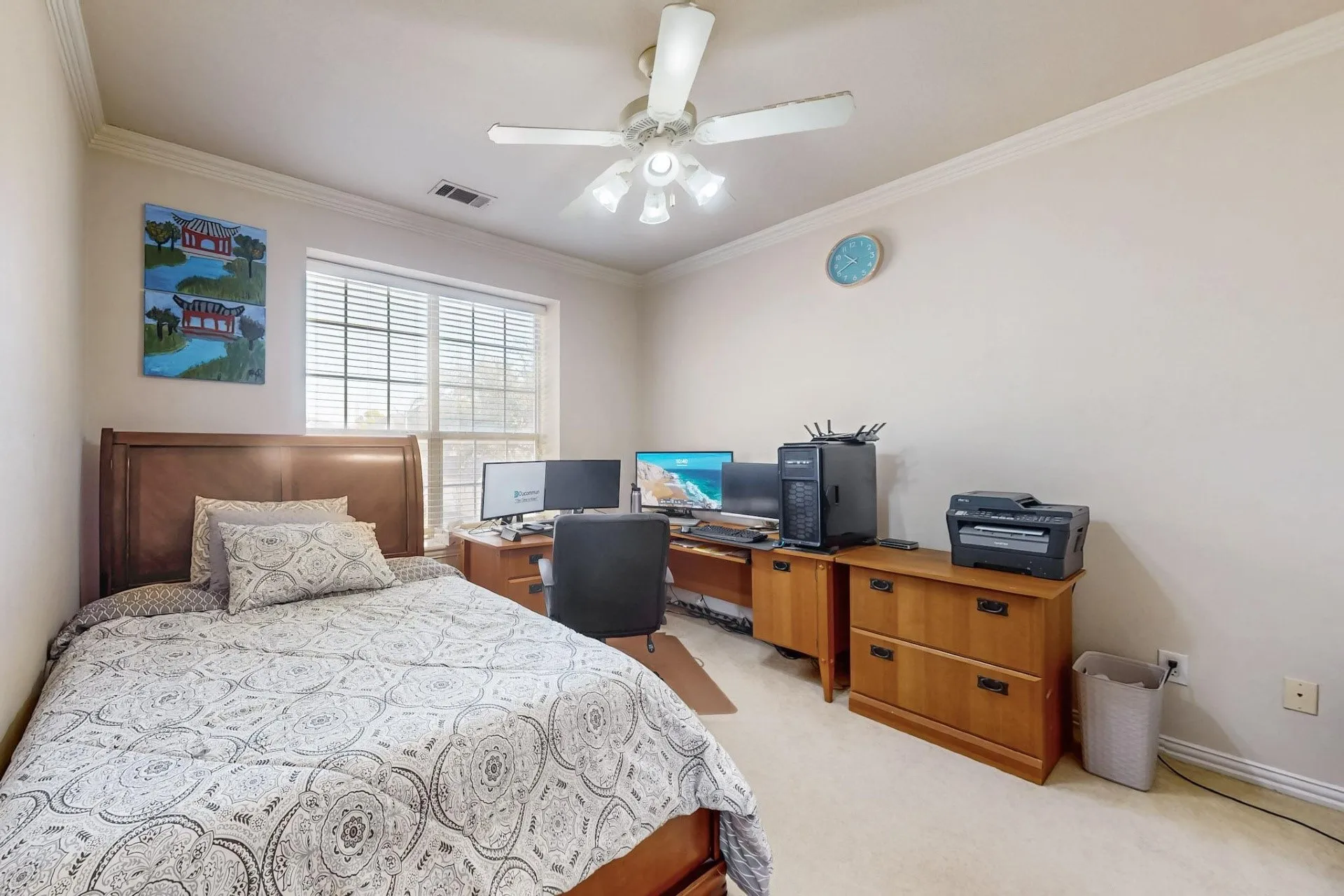 Neutral-toned room featuring a multi-light ceiling fan, crown molding, and carpeting