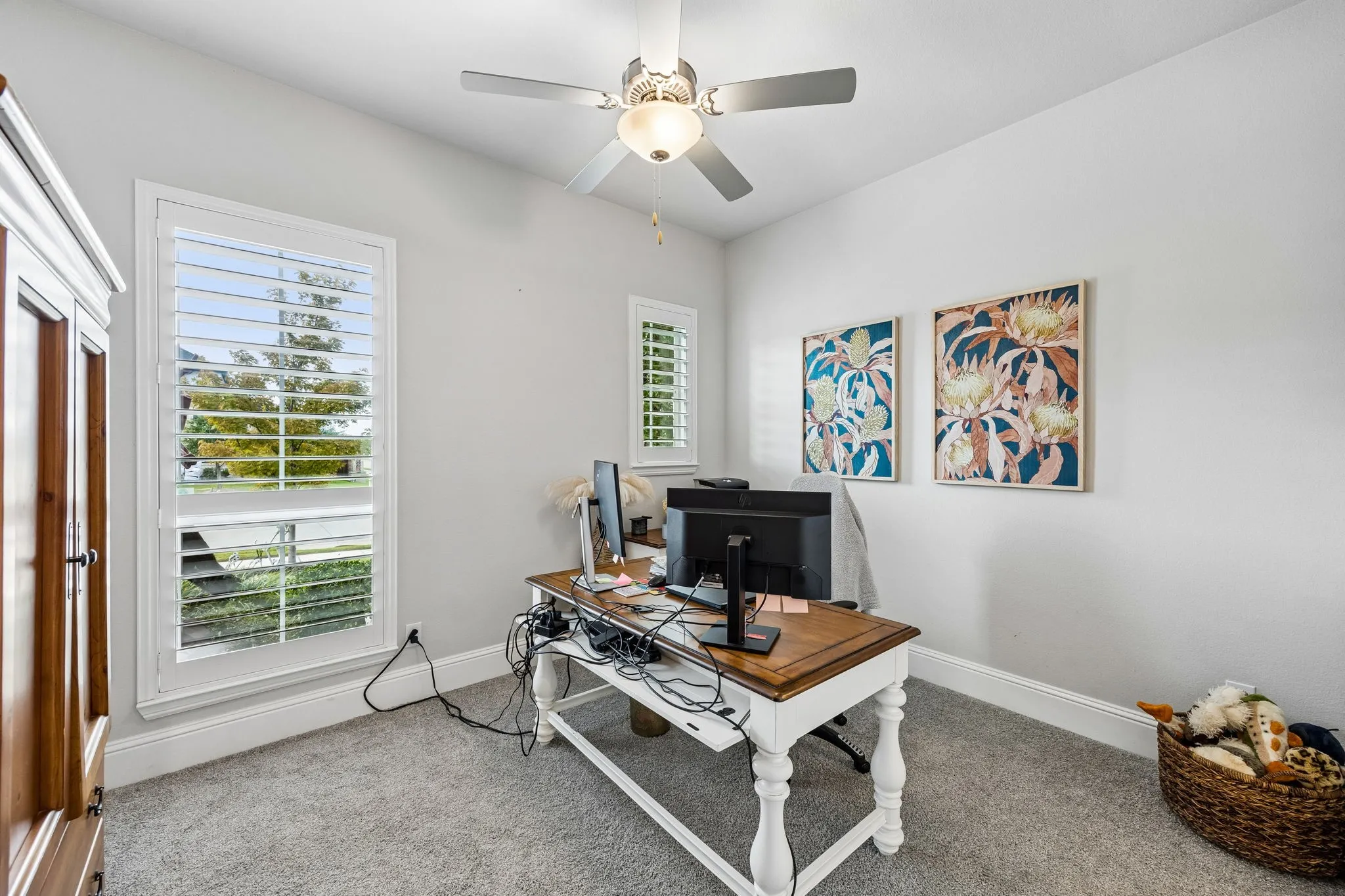 One of the 3 additional bedrooms. This one faces front and is used as an additional office now