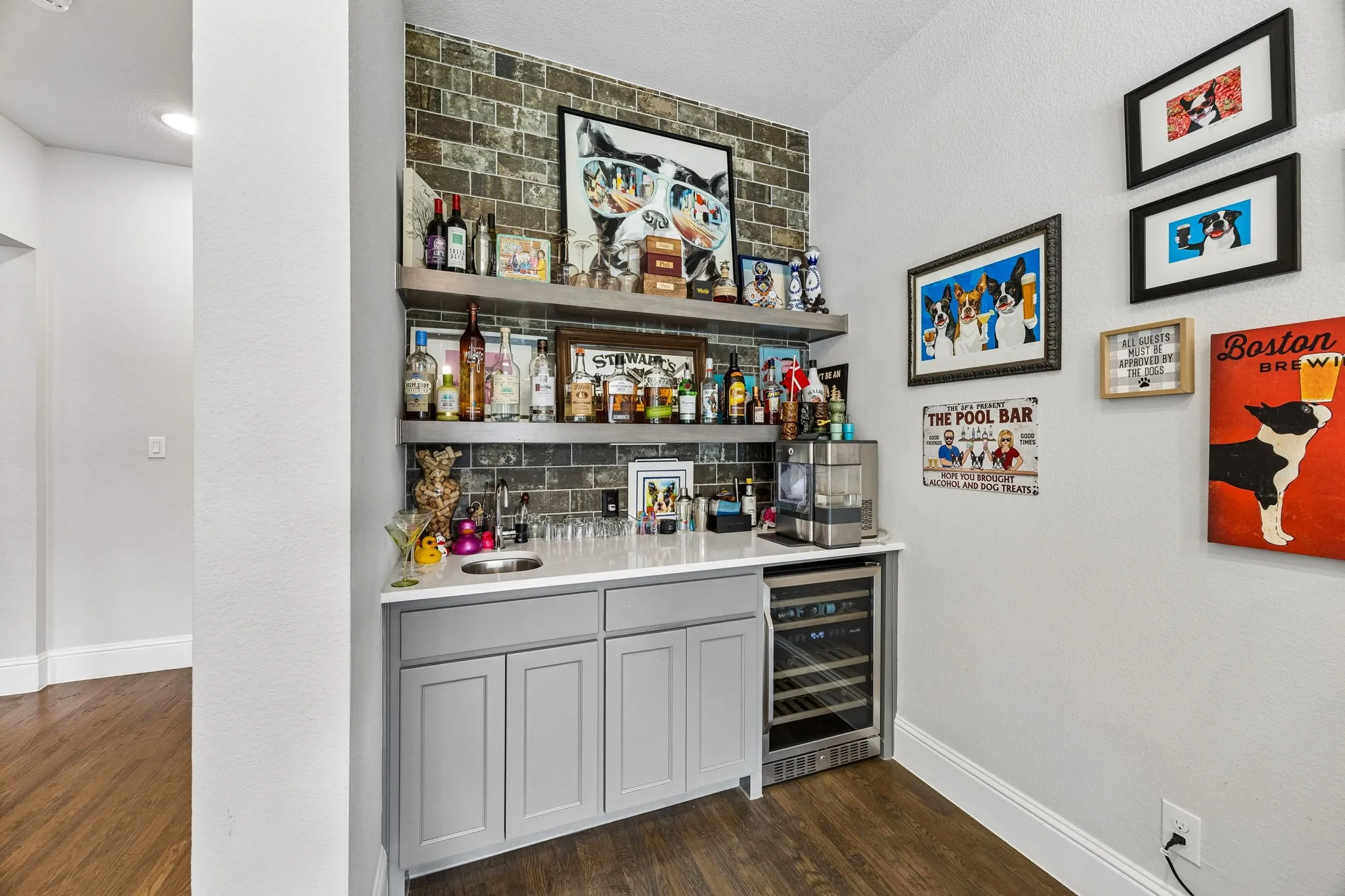 Wet bar with built in wine cooler in second living room.