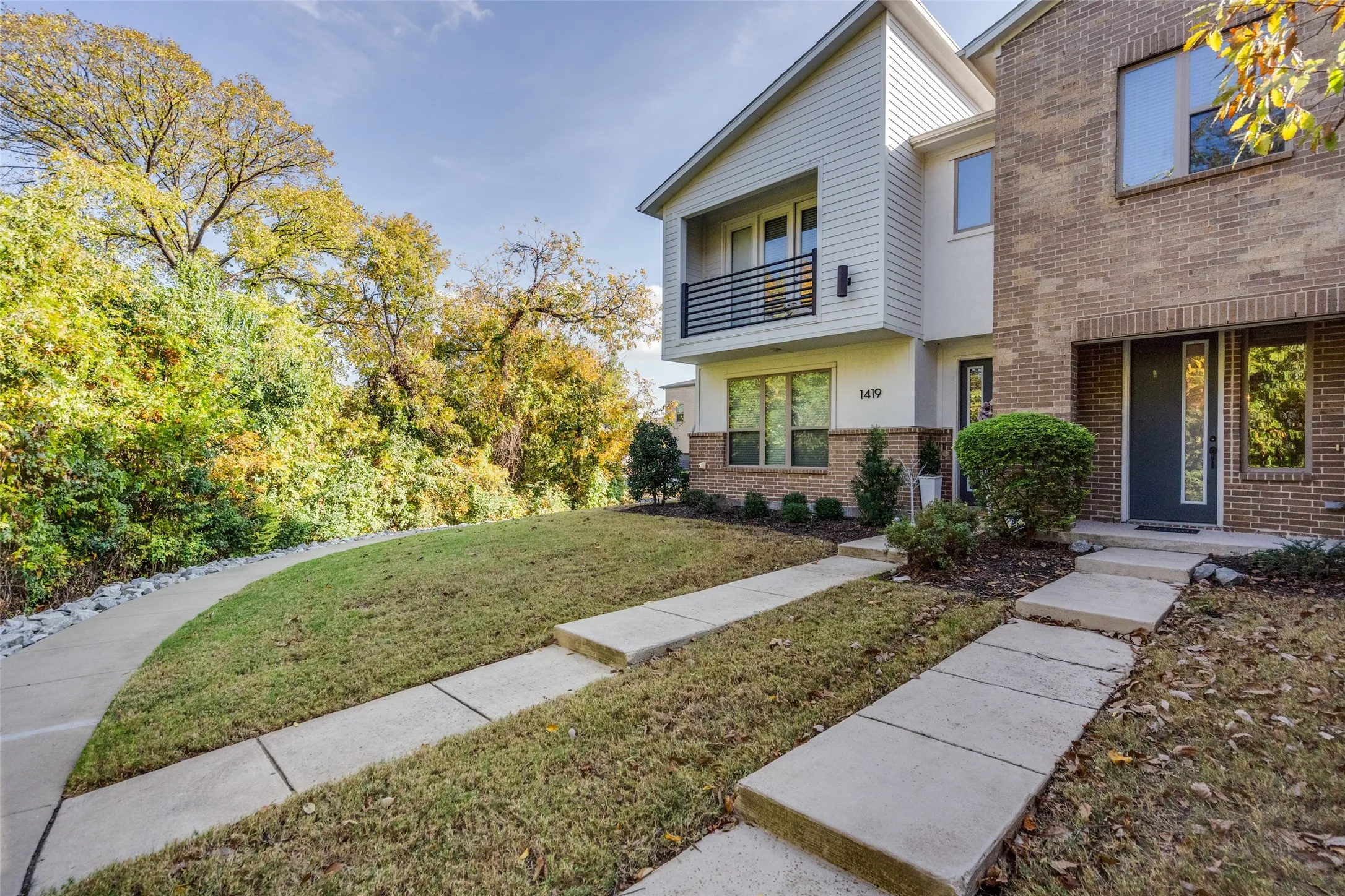 Step out to a walking trail and view of greenbelt, shaded private facing home
