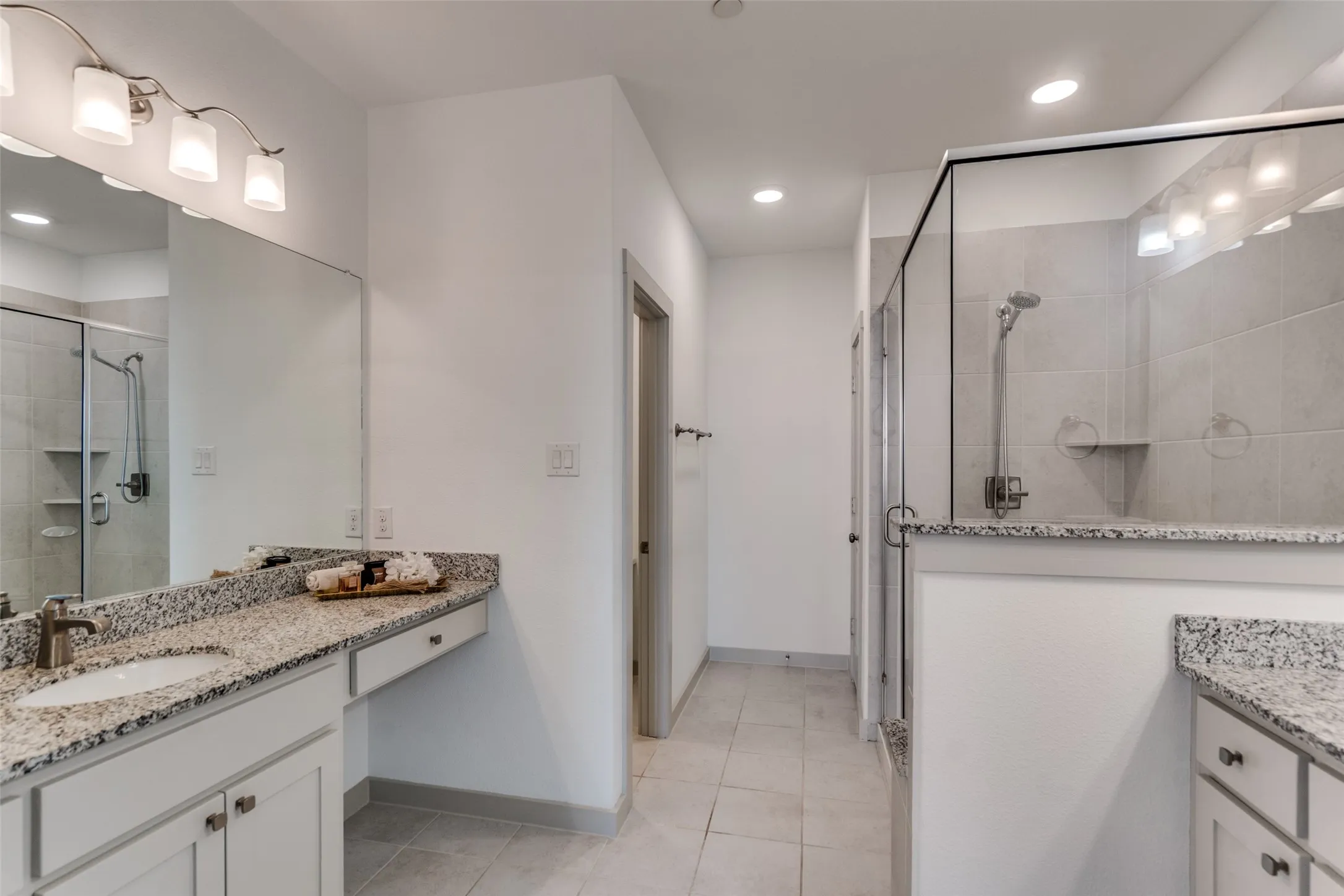 Full luxury ensuite primary bath, walk in closet, shower and, vanities and make up center