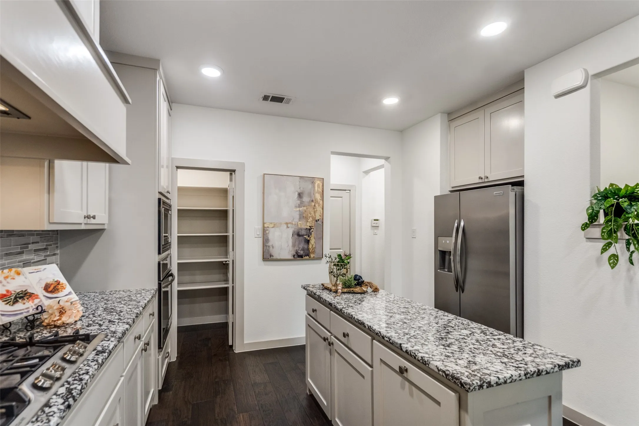 Luxury kitchen upgrade with island, full size walk in pantry, lots of walk in storage, stainless steel appliances