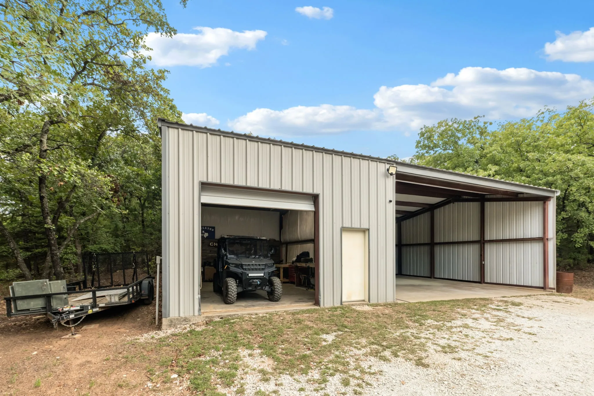 This home features a 20x30 detached shop w. electric & water + adjoining 30x30 covered shop or carport.