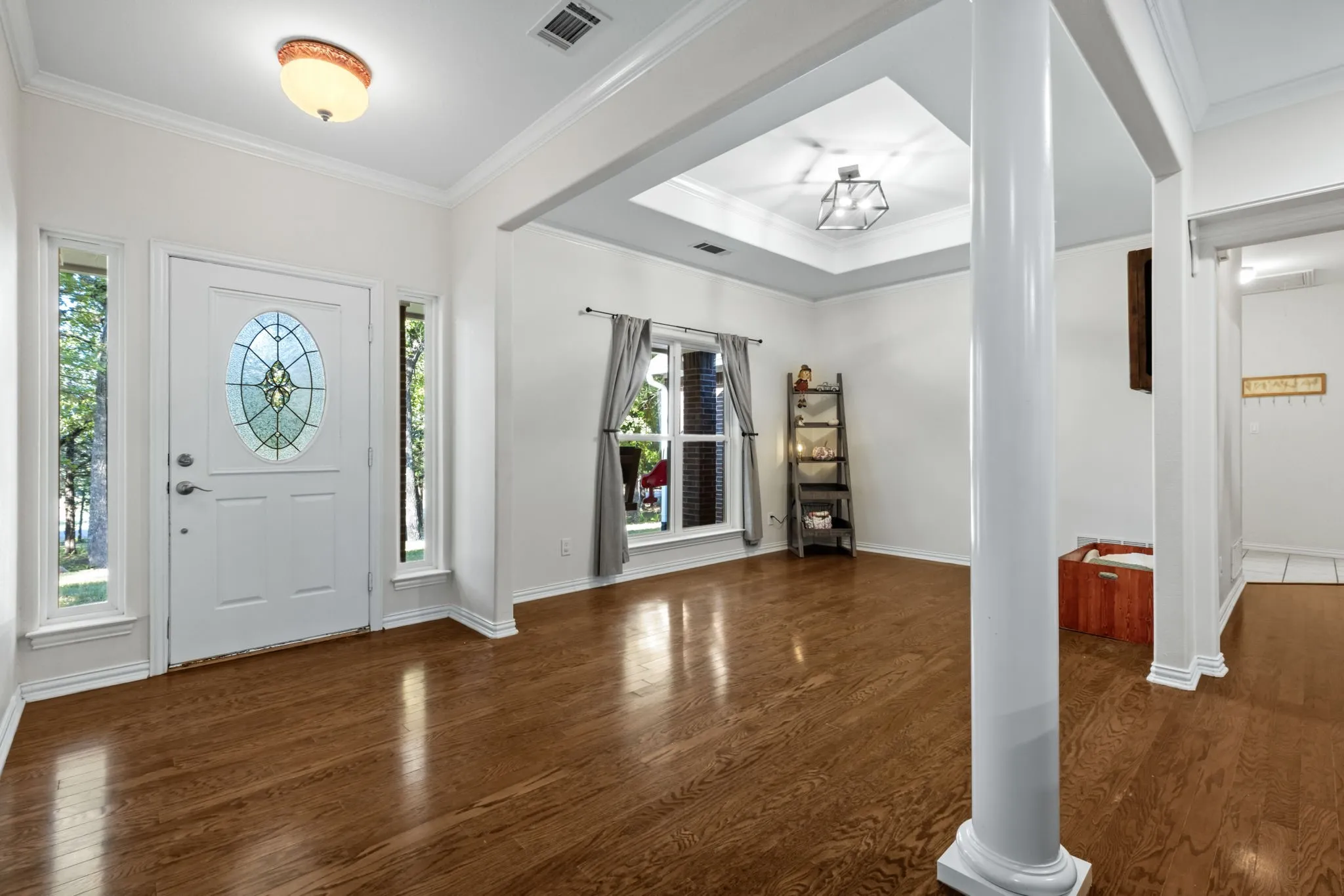 The flexible dining area, currently used as a playroom, could also serve as a home office or hobby space.